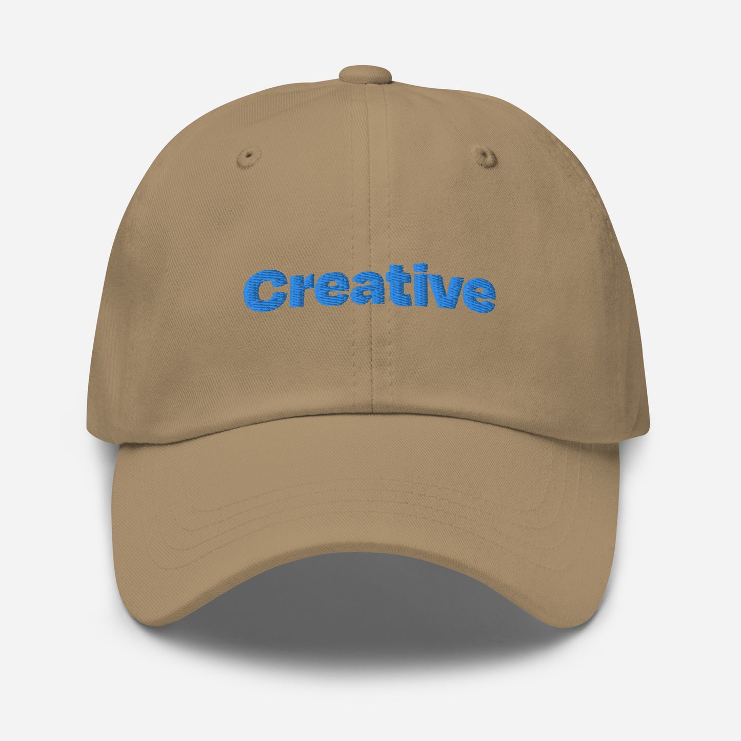 Chicago city editions with “Creative” type in blue embroidery on khaki casual dad hat front view on white background