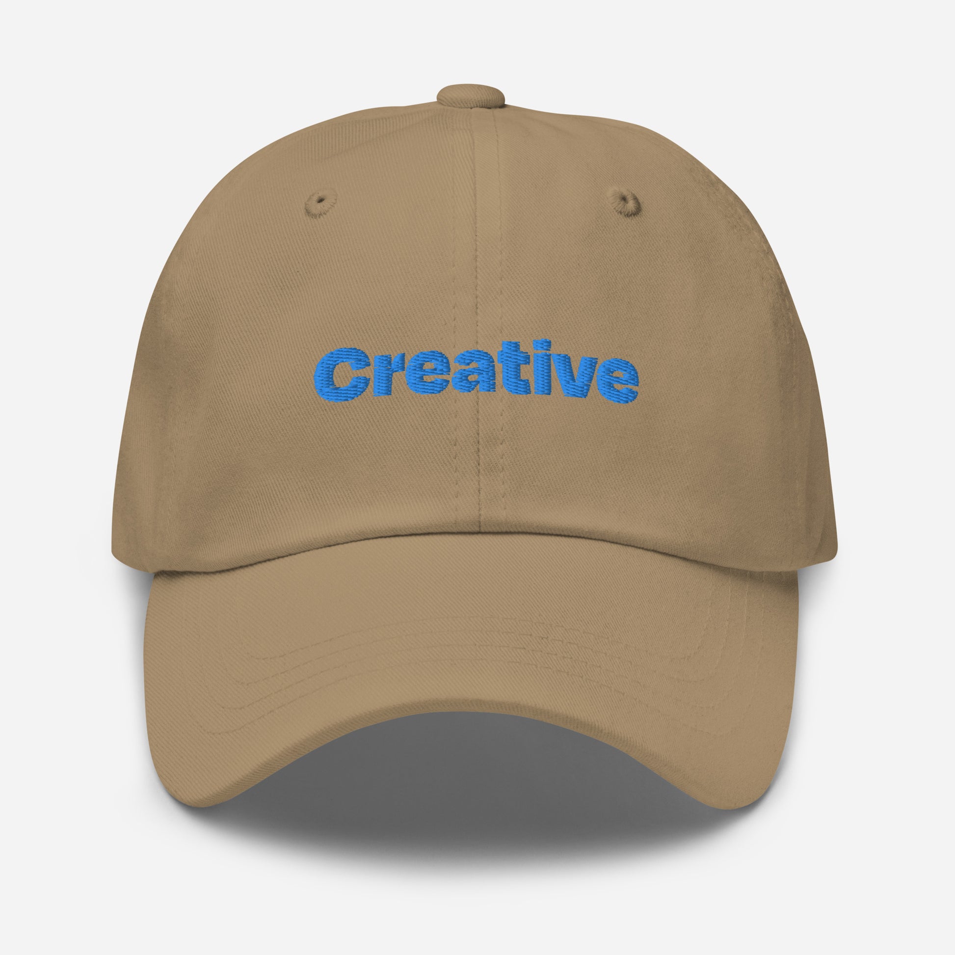 Chicago city editions with “Creative” type in blue embroidery on khaki casual dad hat front view on white background