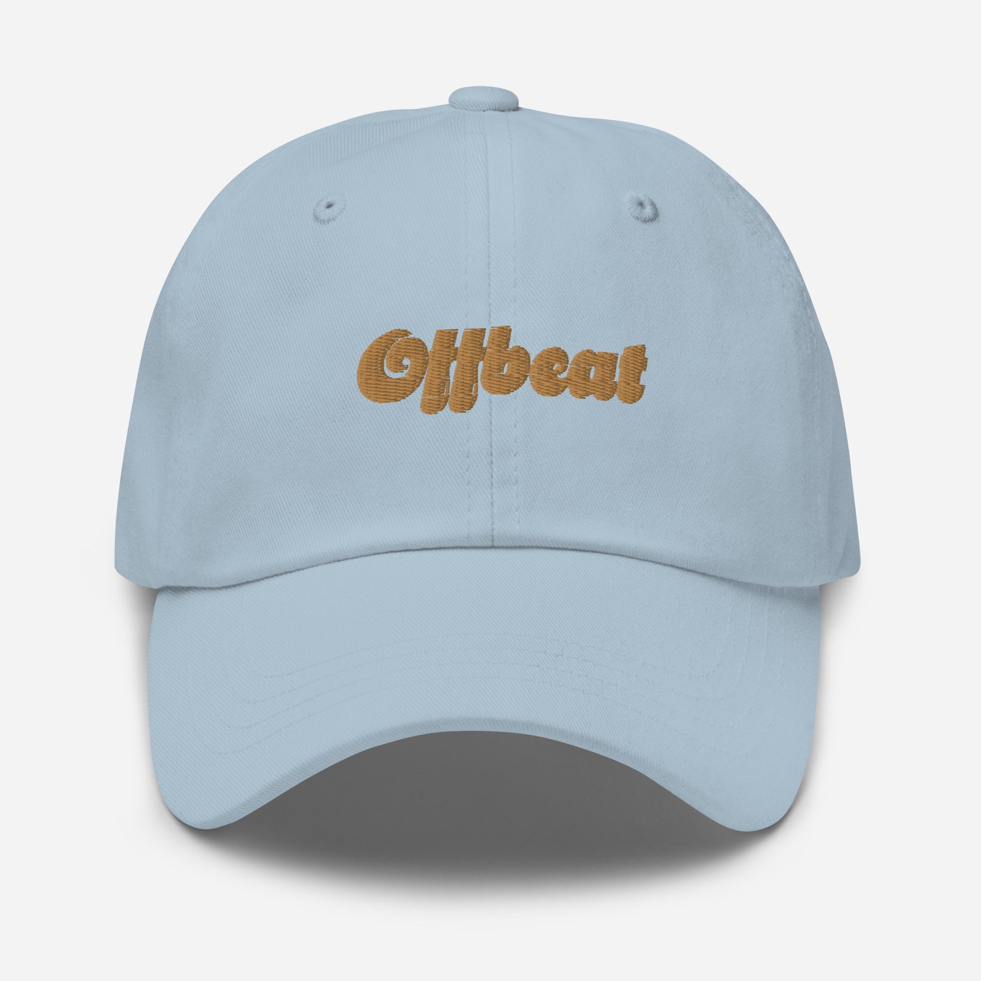 Portland city editions with “Offbeat” type in gold embroidery on light blue casual dad hat front view on white background