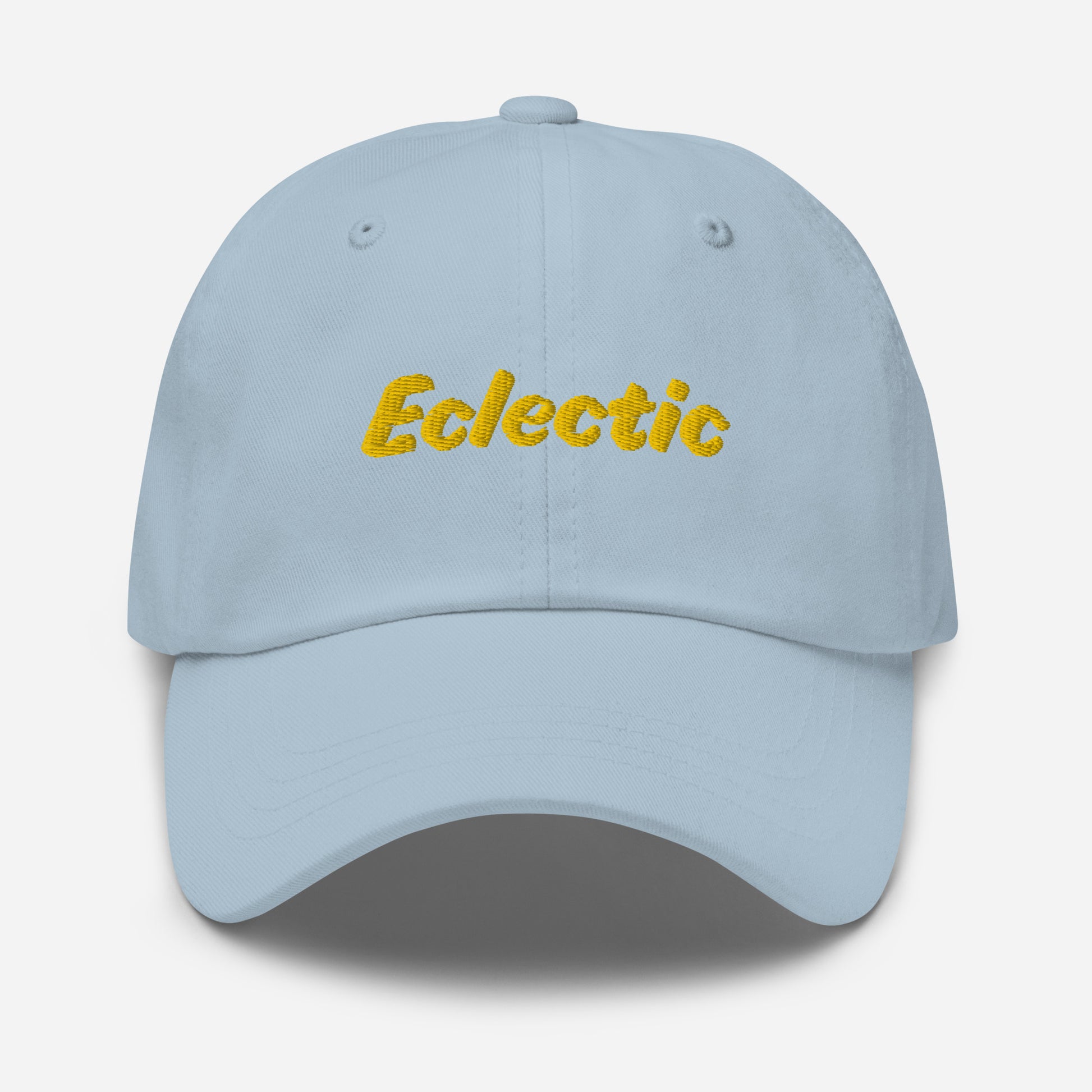 Austin city editions with “Eclectic” type in yellow embroidery on light blue casual dad hat front view on white background