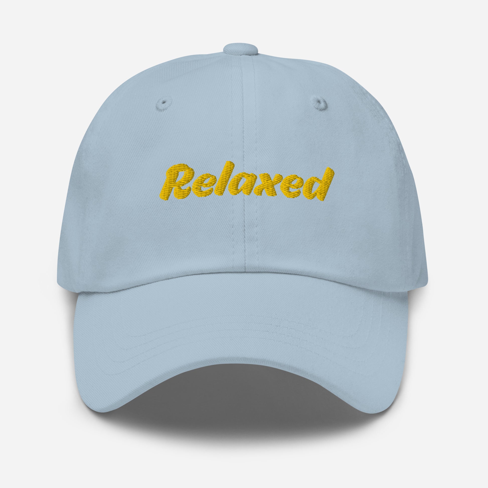 Austin city editions with “Relaxed” type in yellow embroidery on light blue casual dad hat front view on white background