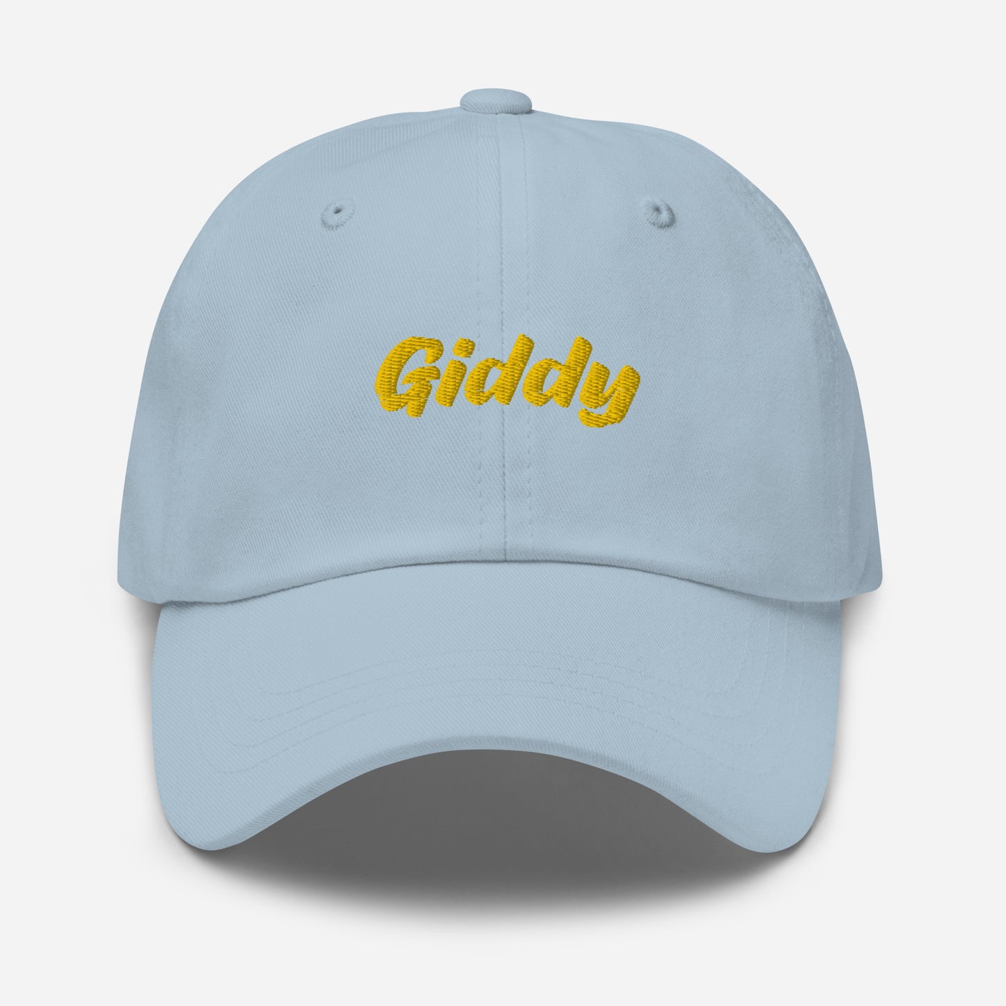 Austin city editions with “Giddy” type in yellow embroidery on light blue casual dad hat front view on white background