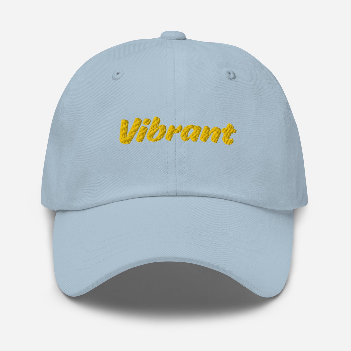 Austin city editions with “Vibrant” type in yellow embroidery on light blue casual dad hat front view on white background