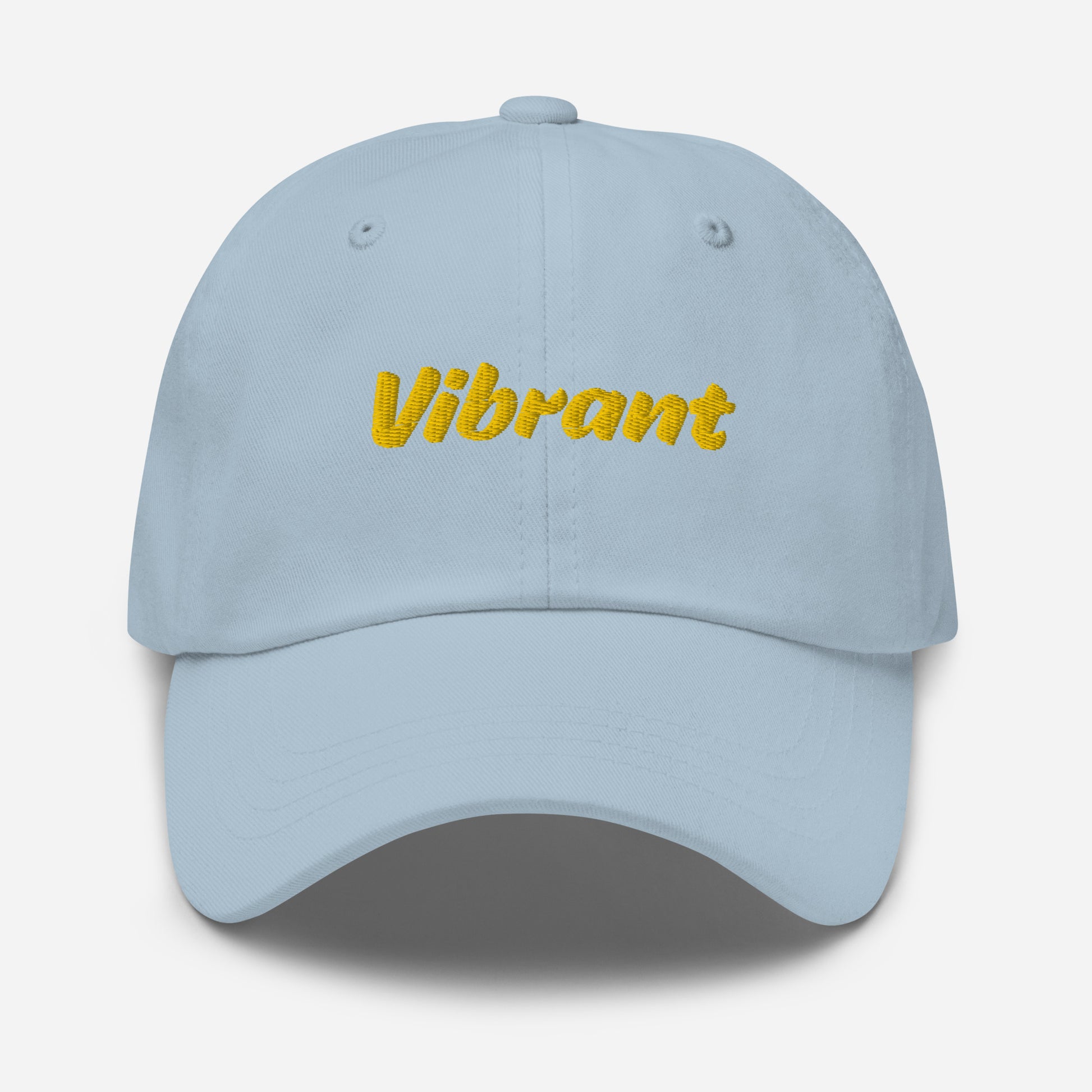 Austin city editions with “Vibrant” type in yellow embroidery on light blue casual dad hat front view on white background