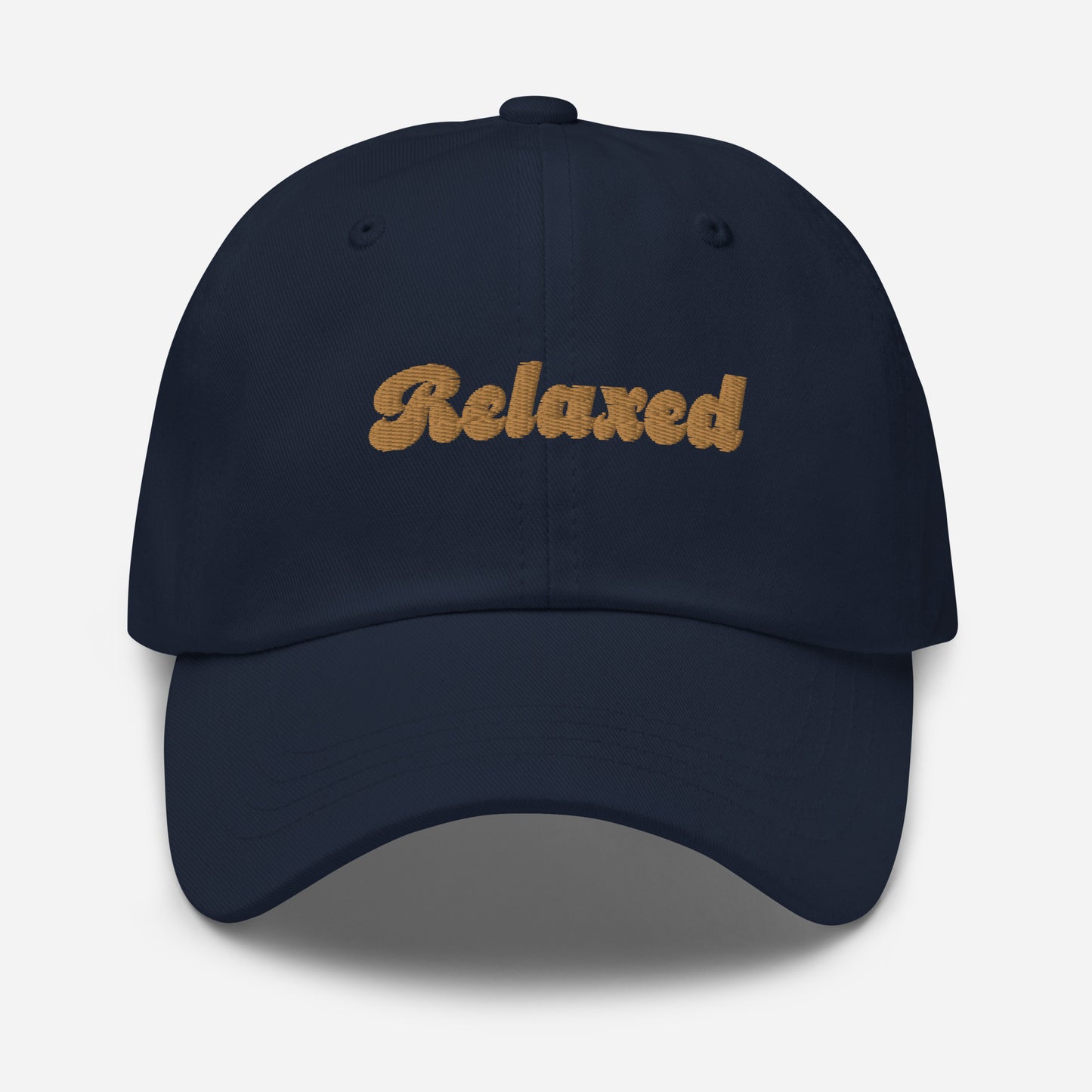 Portland city editions with “Relaxed” type in gold embroidery on navy casual dad hat front view on white background