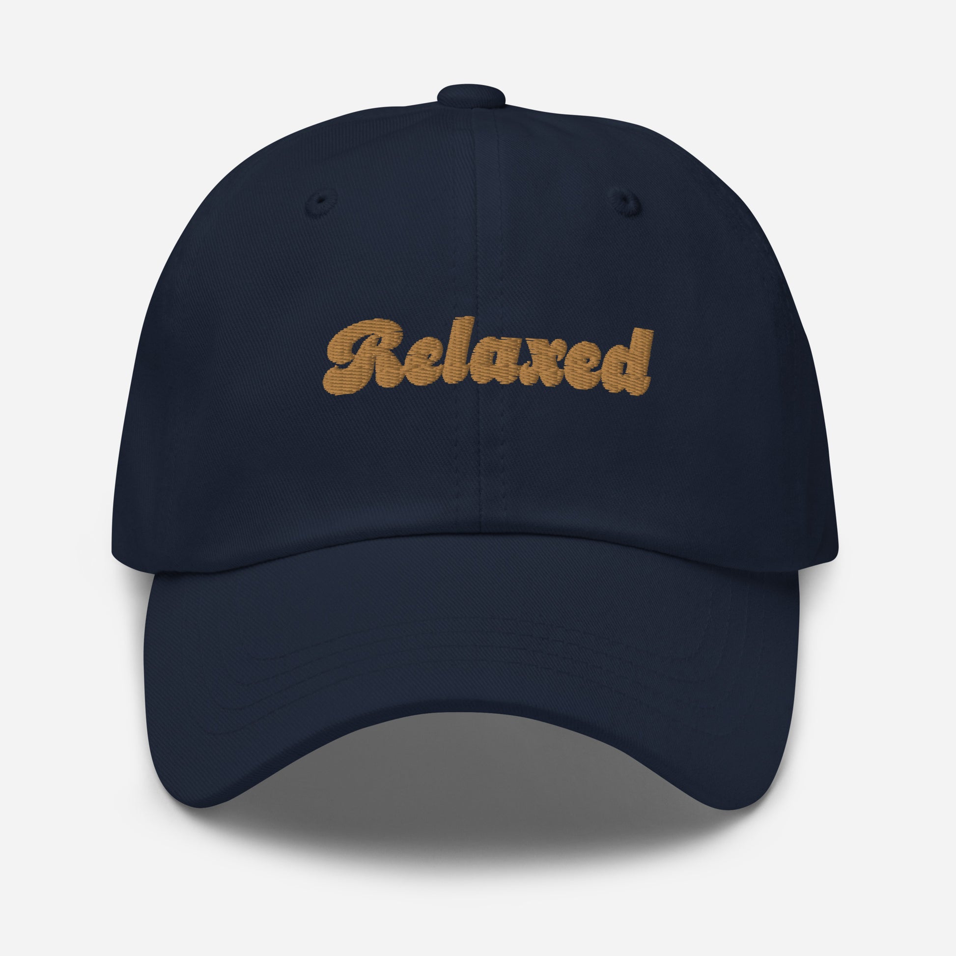Portland city editions with “Relaxed” type in gold embroidery on navy casual dad hat front view on white background