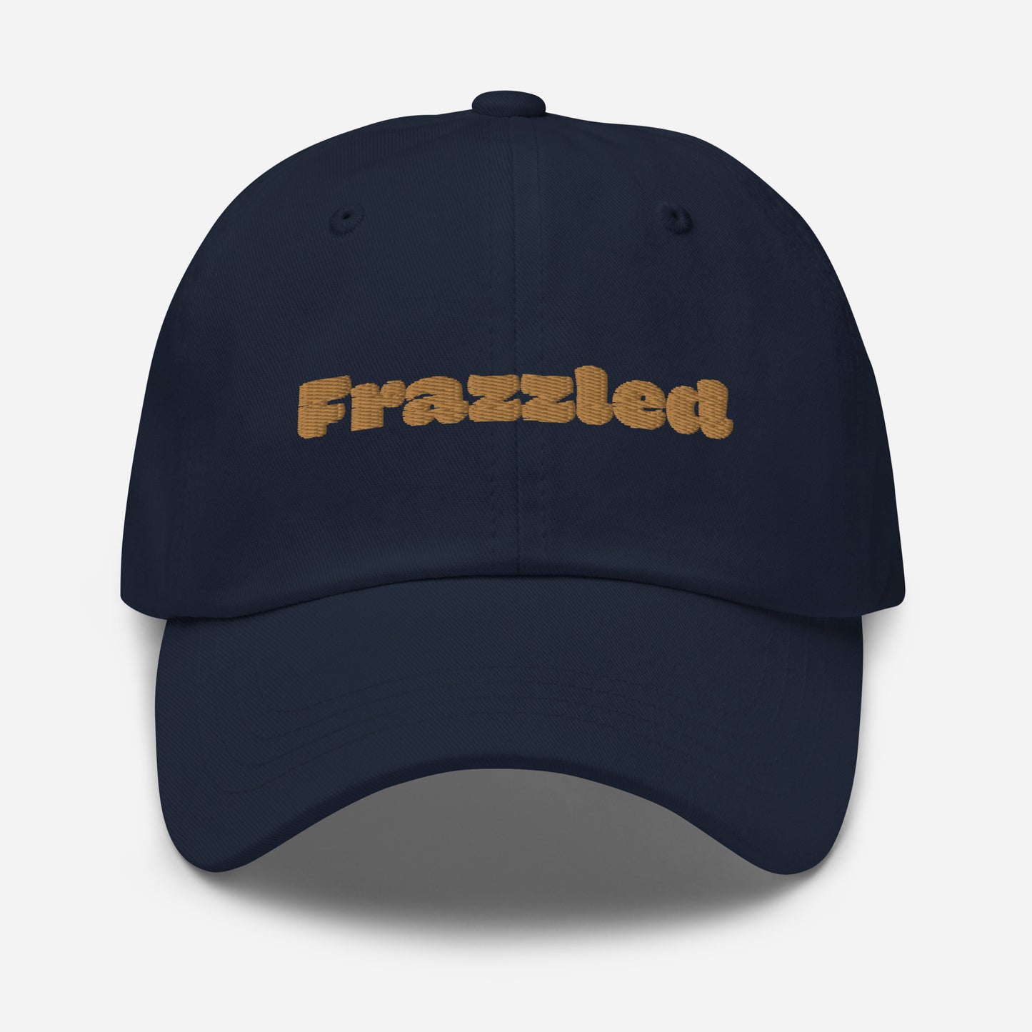 Los Angeles city editions with “Frazzled” type in gold embroidery on navy casual dad hat front view on white background