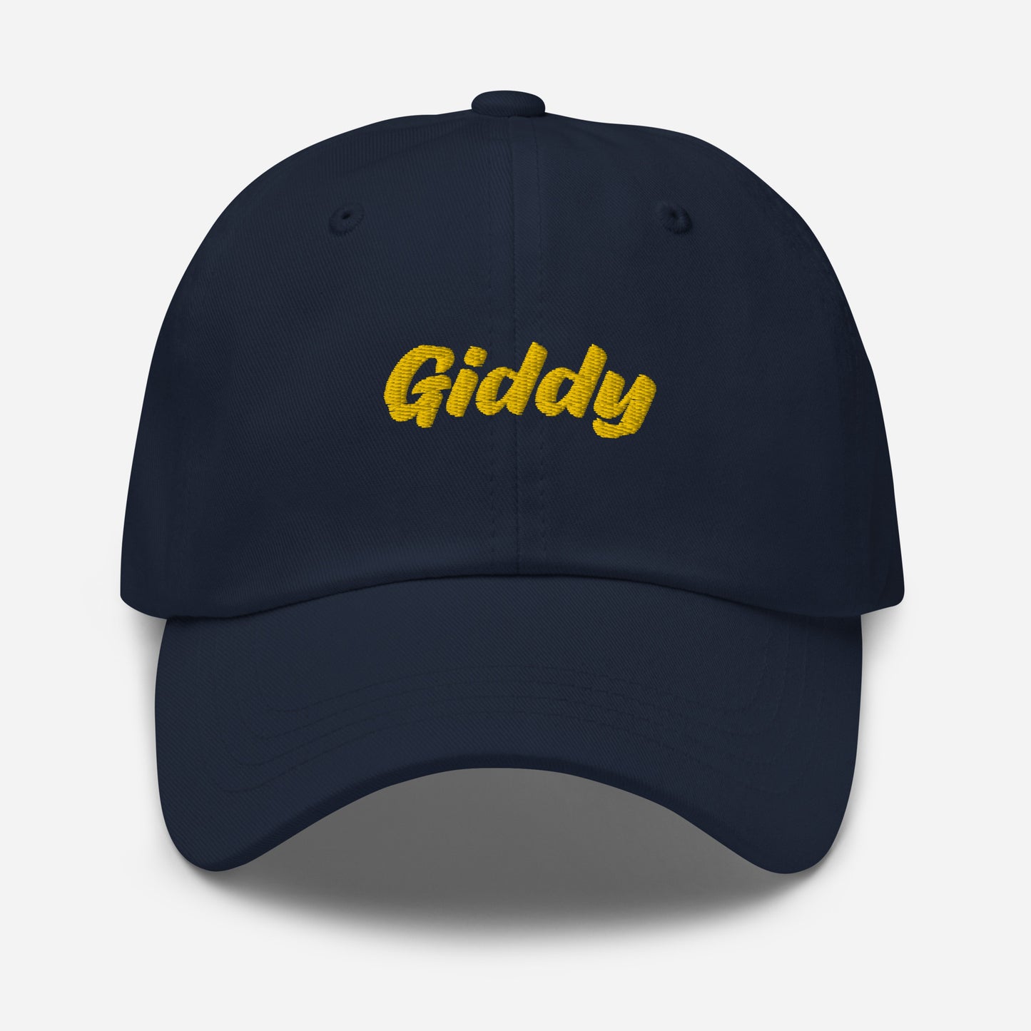 Austin city editions with “Giddy” type in yellow embroidery on navy casual dad hat front view on white background