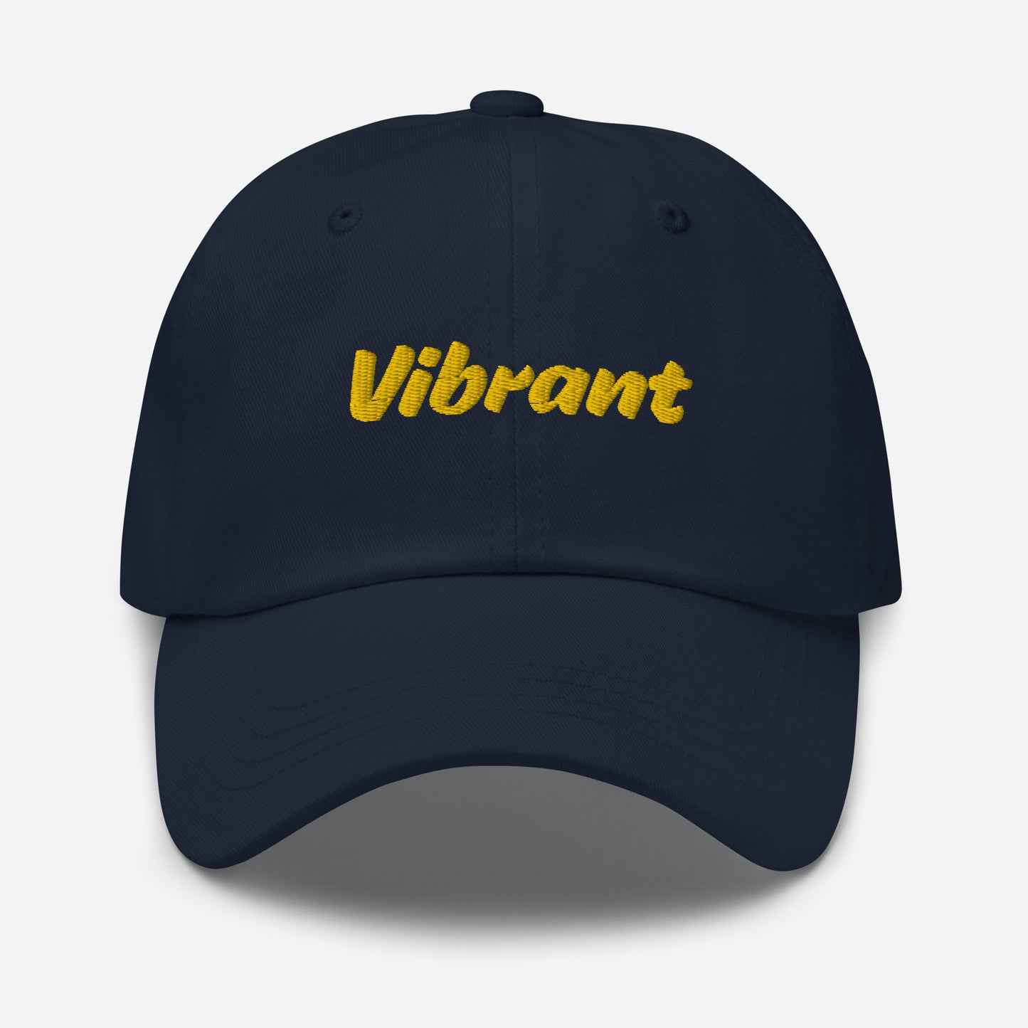 Austin city editions with “Vibrant” type in yellow embroidery on navy casual dad hat front view on white background