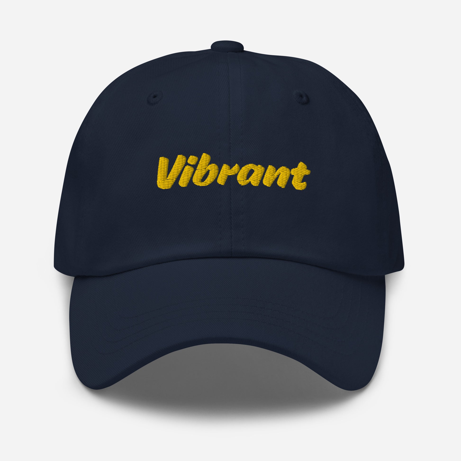 Austin city editions with “Vibrant” type in yellow embroidery on navy casual dad hat front view on white background