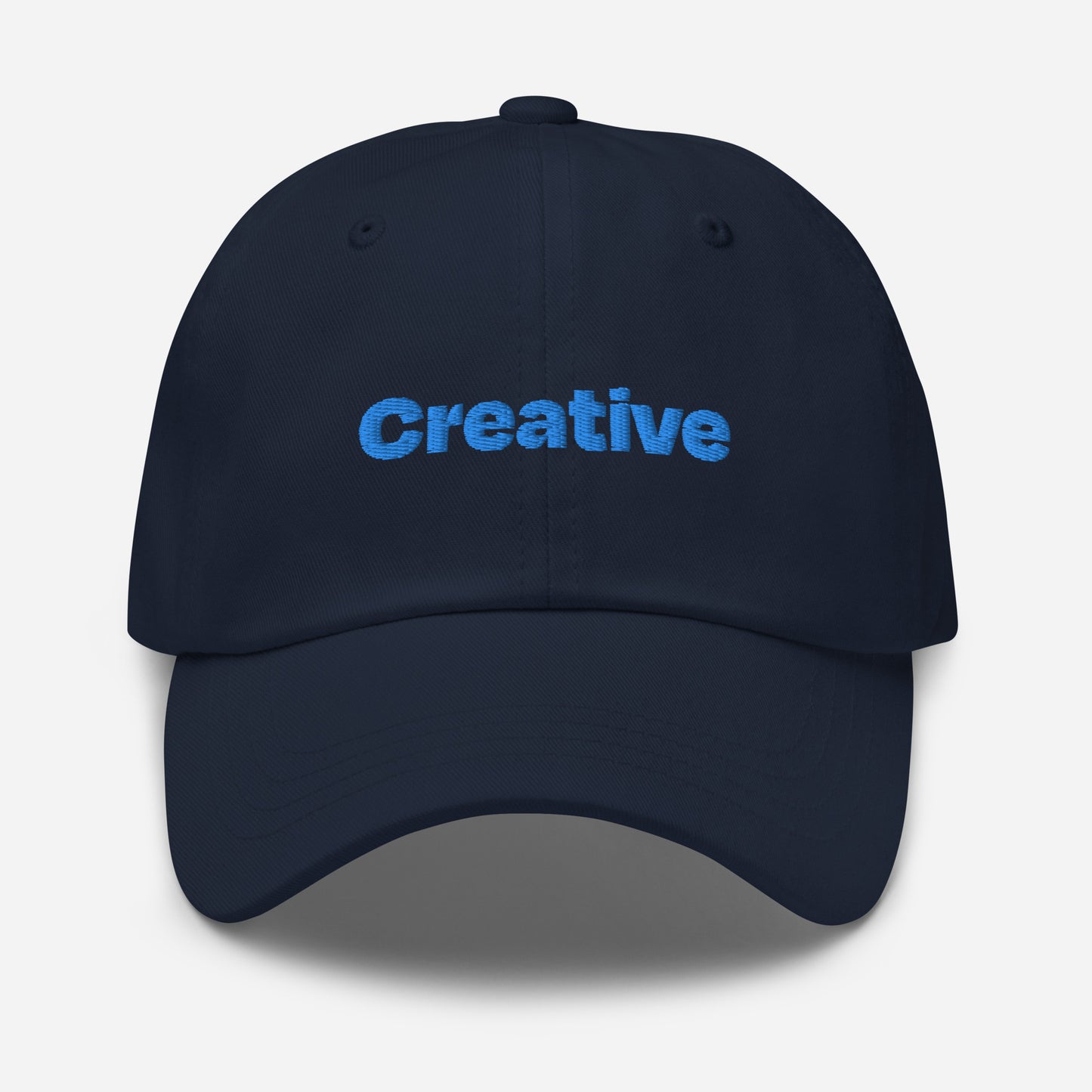 Chicago city editions with “Creative” type in blue embroidery on navy casual dad hat front view on white background