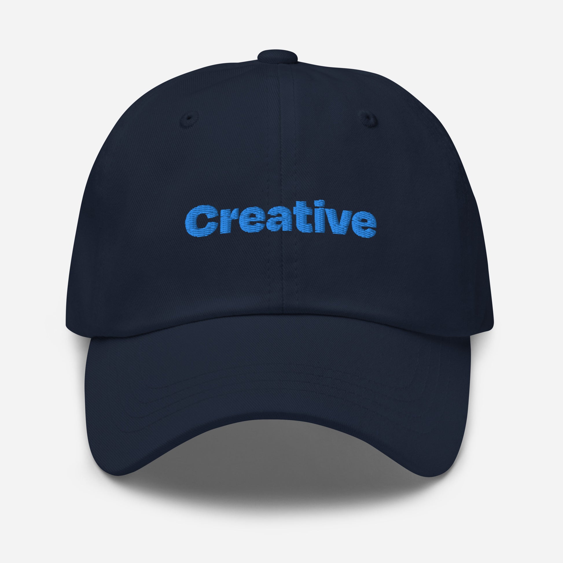 Chicago city editions with “Creative” type in blue embroidery on navy casual dad hat front view on white background