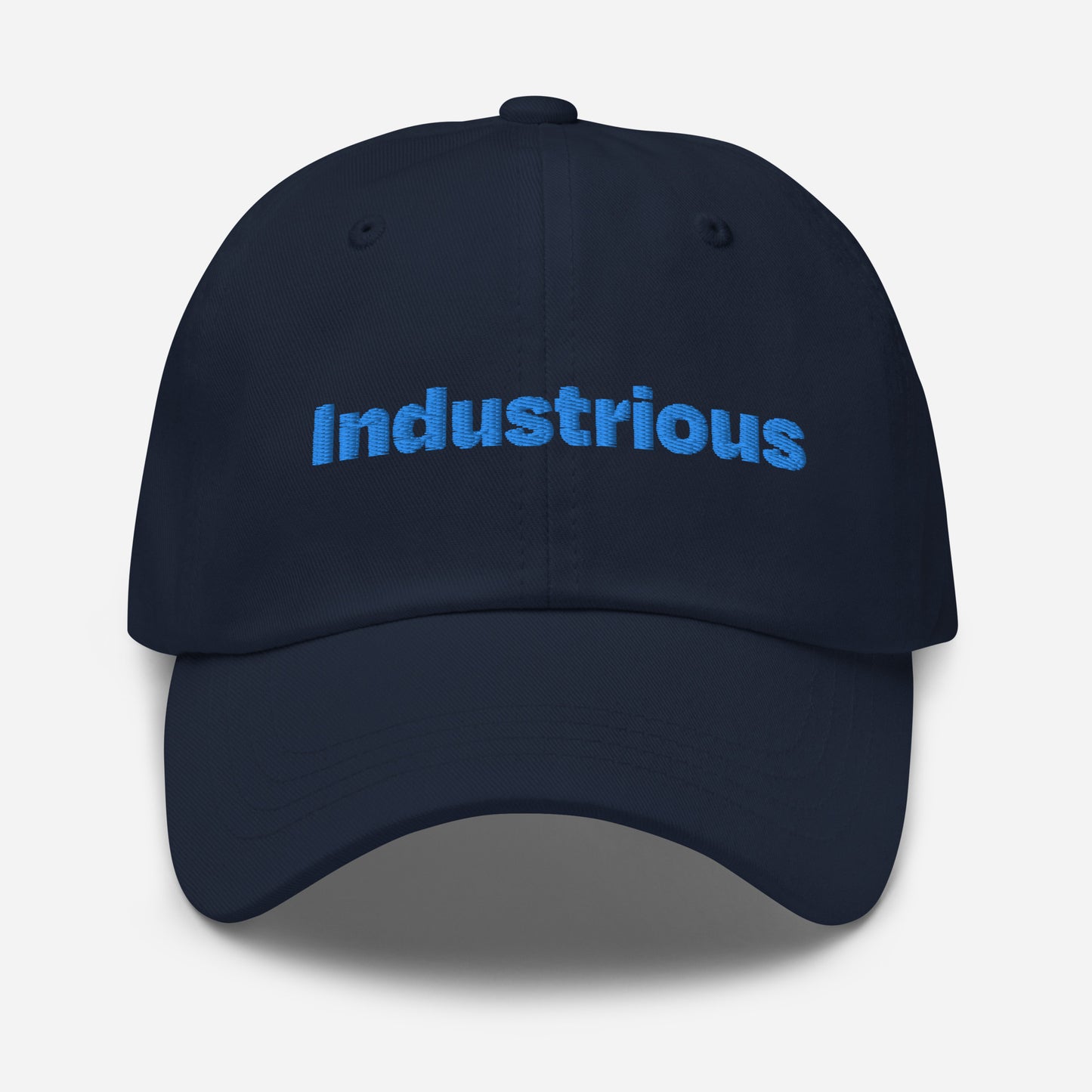Chicago city editions with “Industrious” type in blue embroidery on navy casual dad hat front view on white background