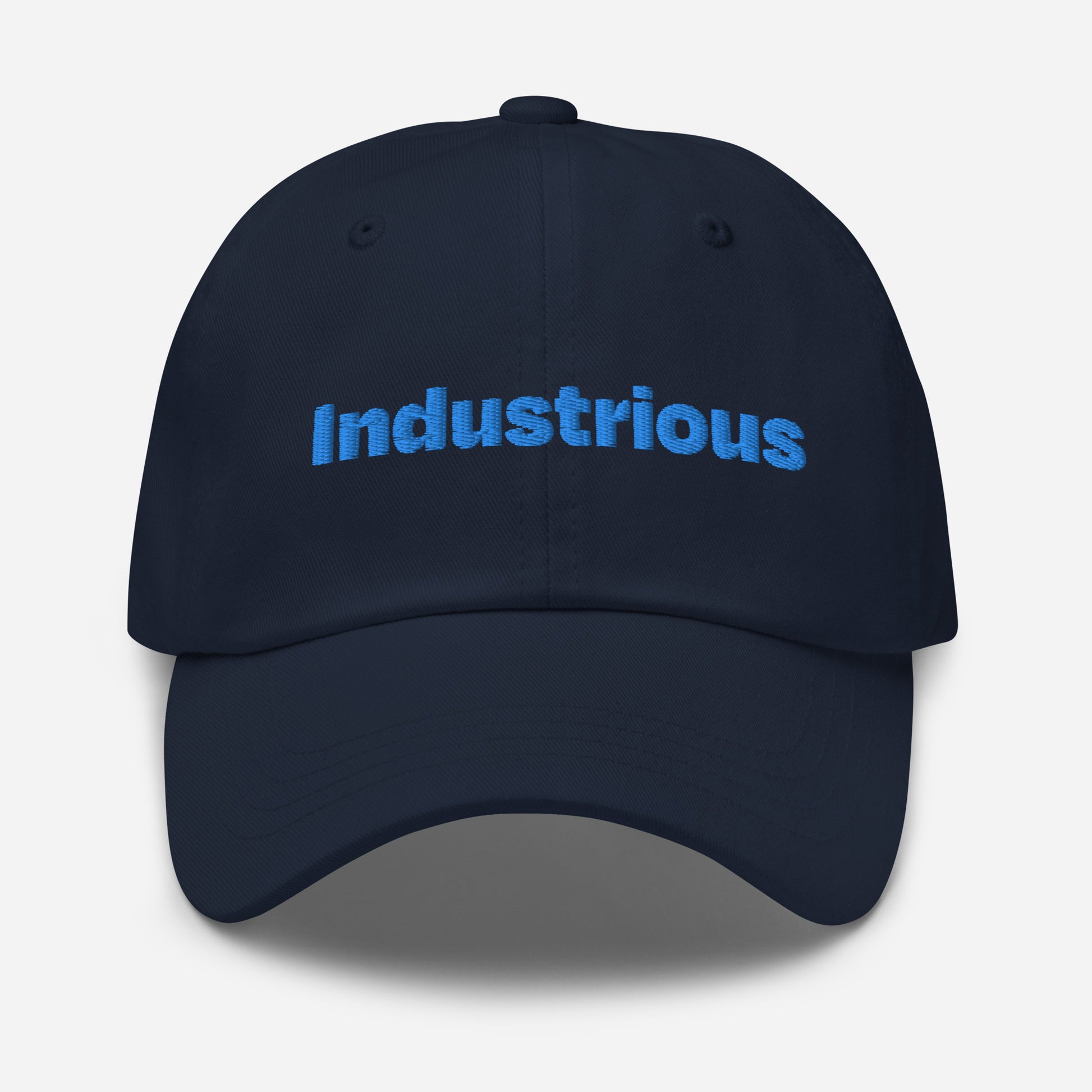 Chicago city editions with “Industrious” type in blue embroidery on navy casual dad hat front view on white background