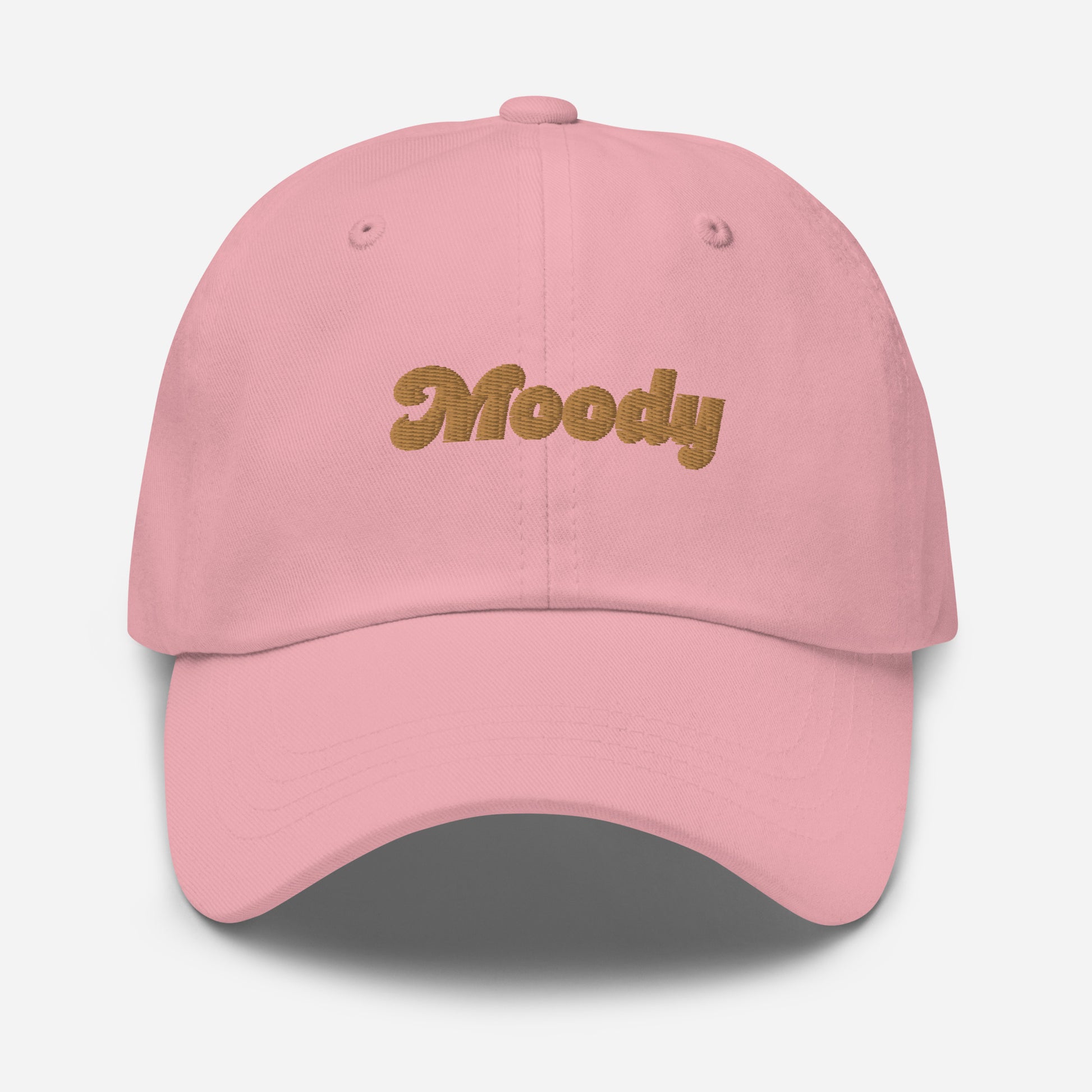 Portland city editions with “Moody” type in gold embroidery on pink casual dad hat front view on white background