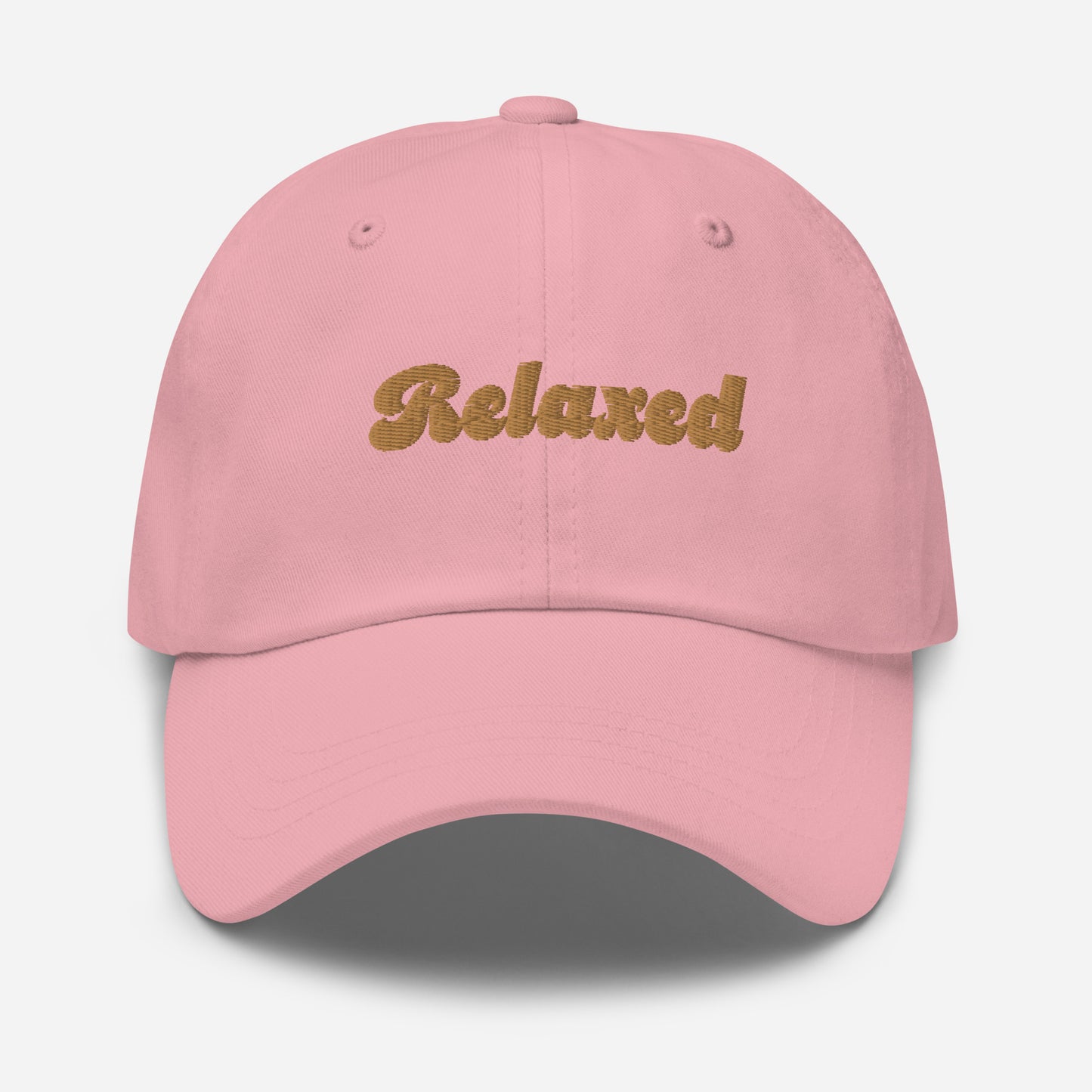 Portland city editions with “Relaxed” type in gold embroidery on pink casual dad hat front view on white background