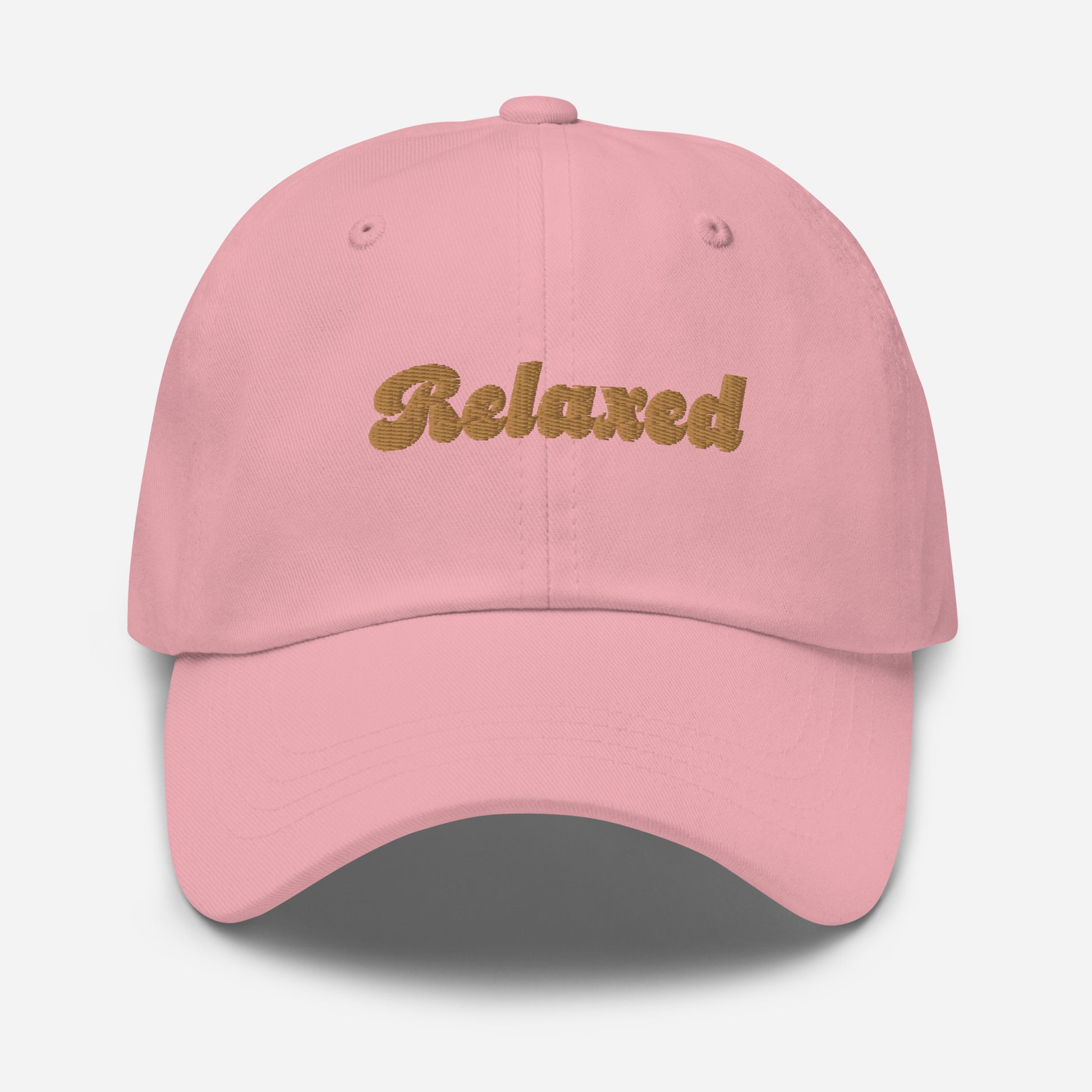 Portland city editions with “Relaxed” type in gold embroidery on pink casual dad hat front view on white background