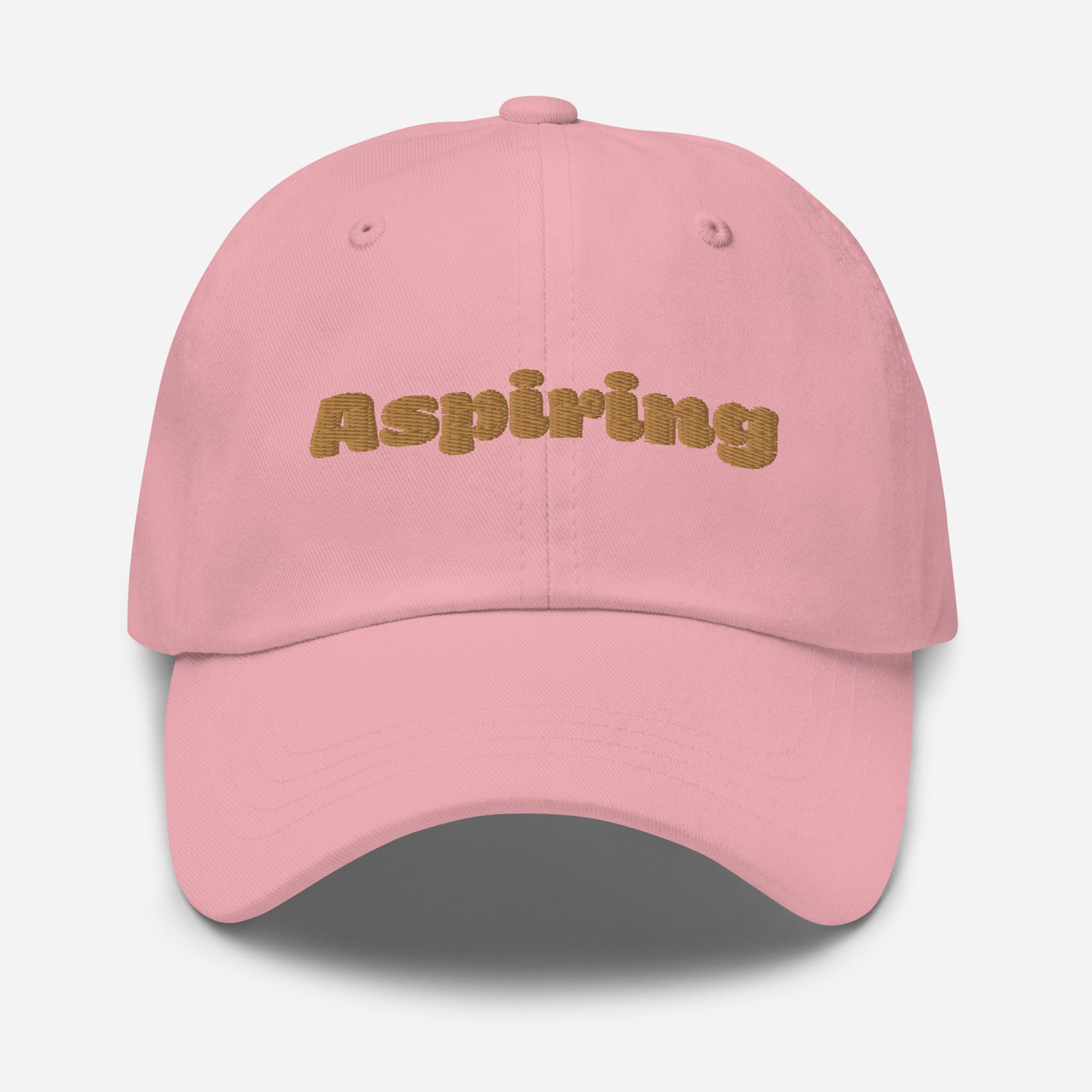 Los Angeles city editions with “Aspiring” type in gold embroidery on pink casual dad hat front view on white background