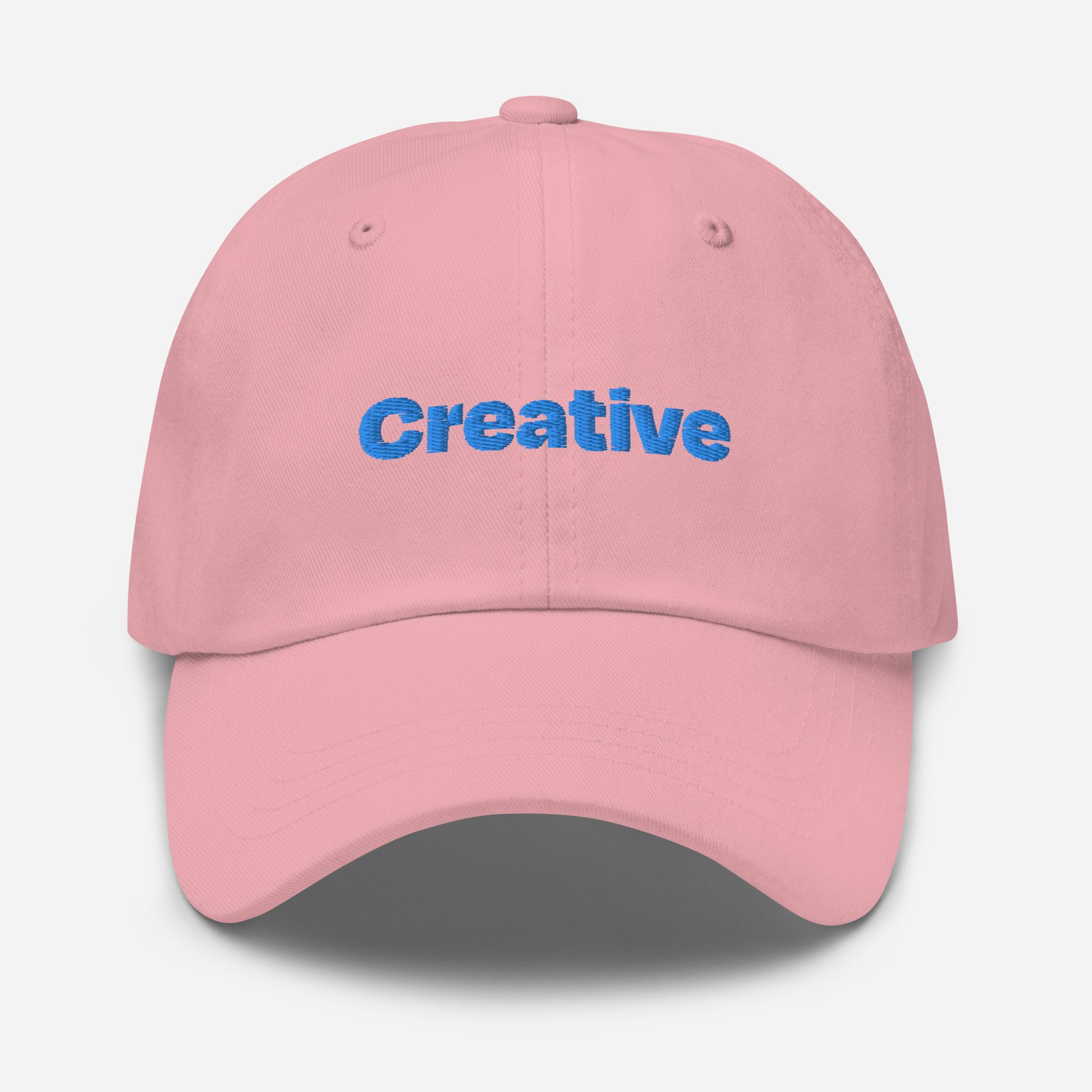 Chicago city editions with “Creative” type in blue embroidery on pink casual dad hat front view on white background