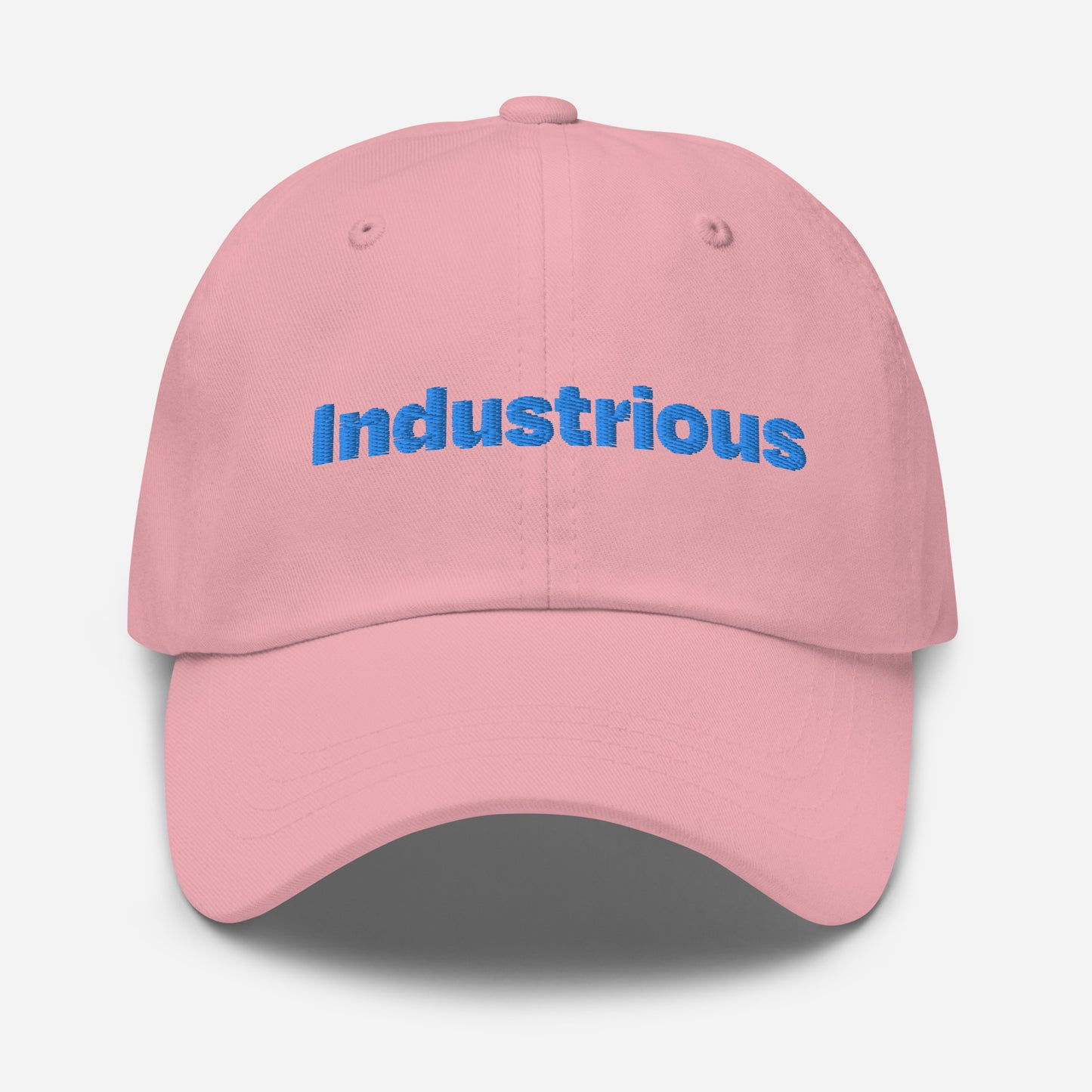 Chicago city editions with “Industrious” type in blue embroidery on pink casual dad hat front view on white background