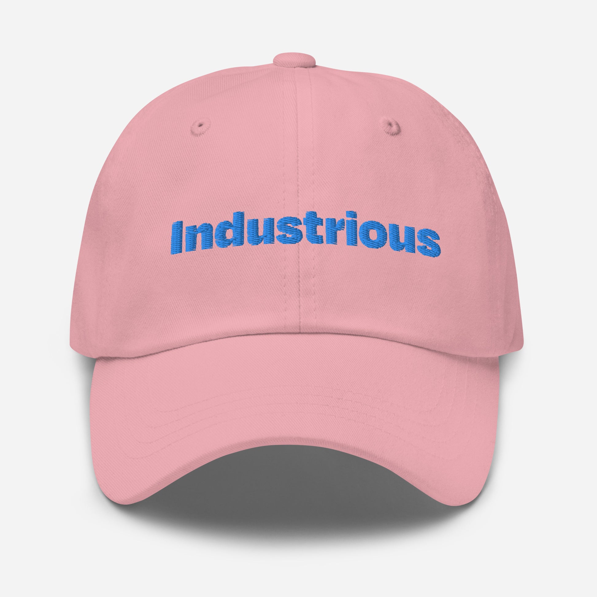 Chicago city editions with “Industrious” type in blue embroidery on pink casual dad hat front view on white background