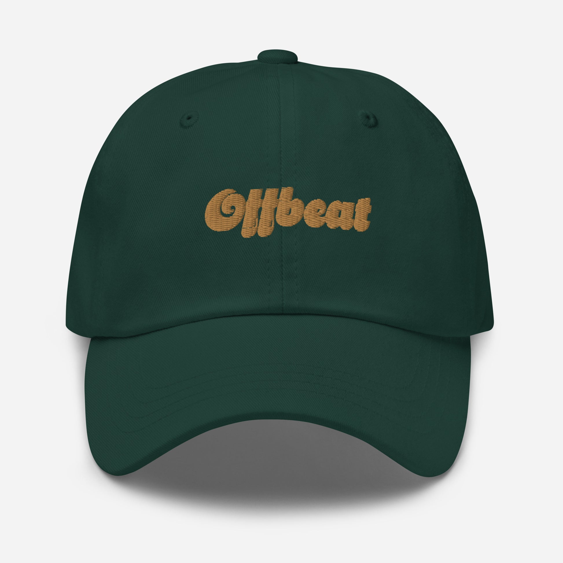 Portland city editions with “Offbeat” type in gold embroidery on green casual dad hat front view on white background