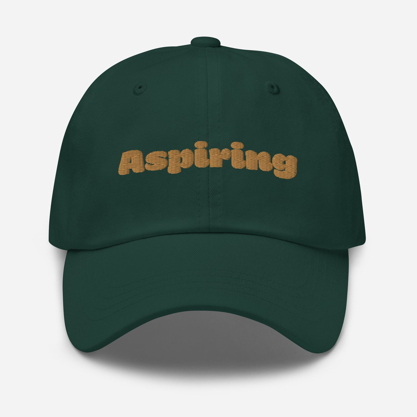 Los Angeles city editions with “Aspiring” type in gold embroidery on green casual dad hat front view on white background