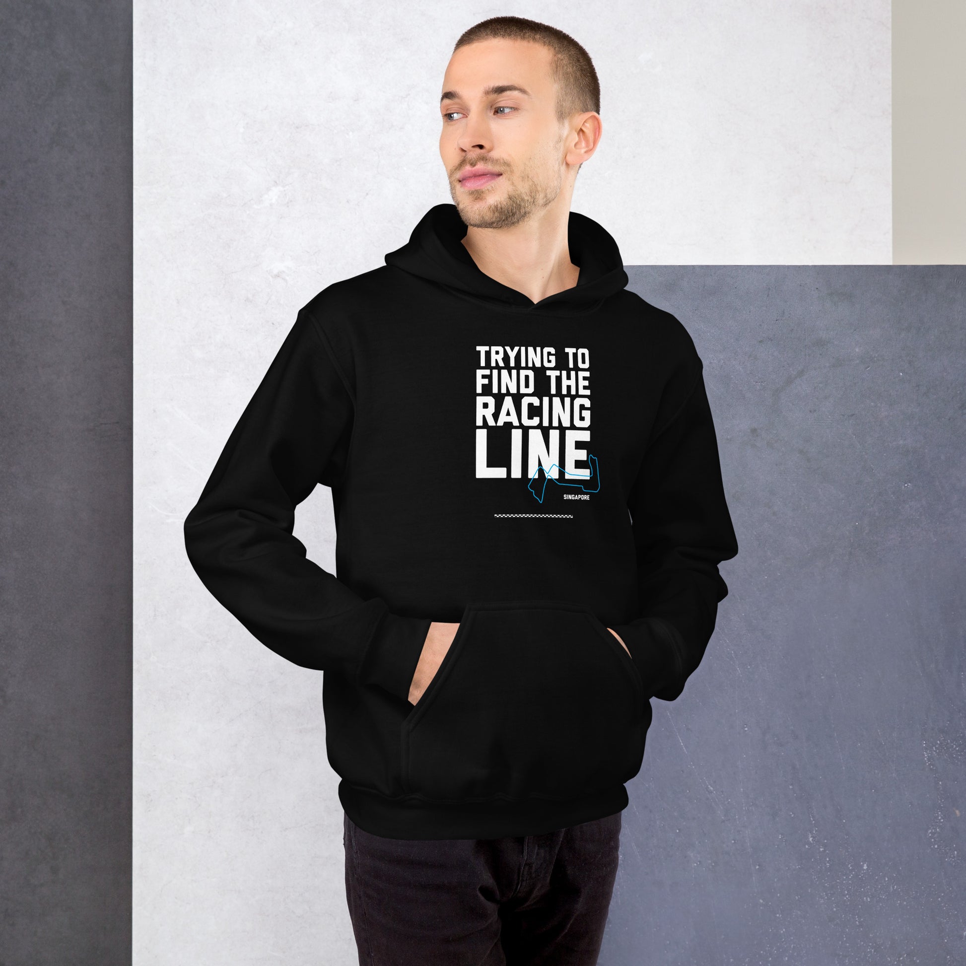 Trying To Find The Racing Line text on black hoodie, front view on male model