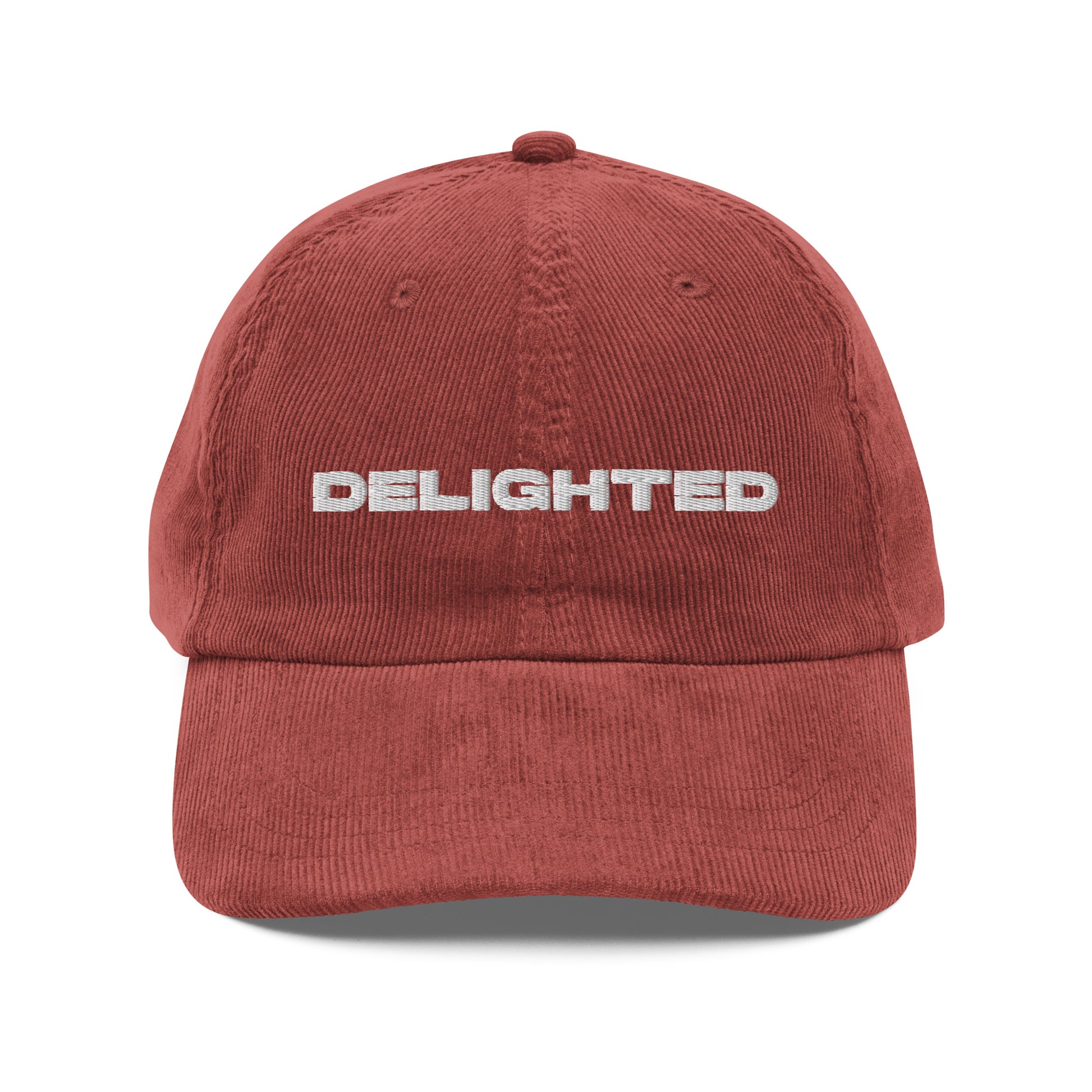 DELIGHTED, text, type, hat, dad hat, corduroy, cozy, design. front view of rust hat on white background