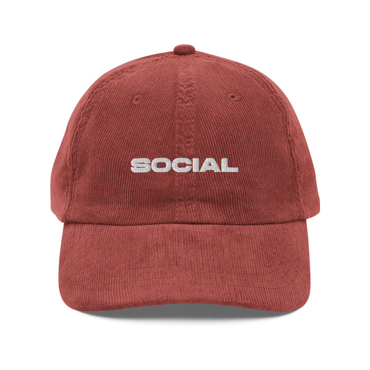 SOCIAL, text, type, hat, dad hat, corduroy, cozy, design. front view of rust hat on white background