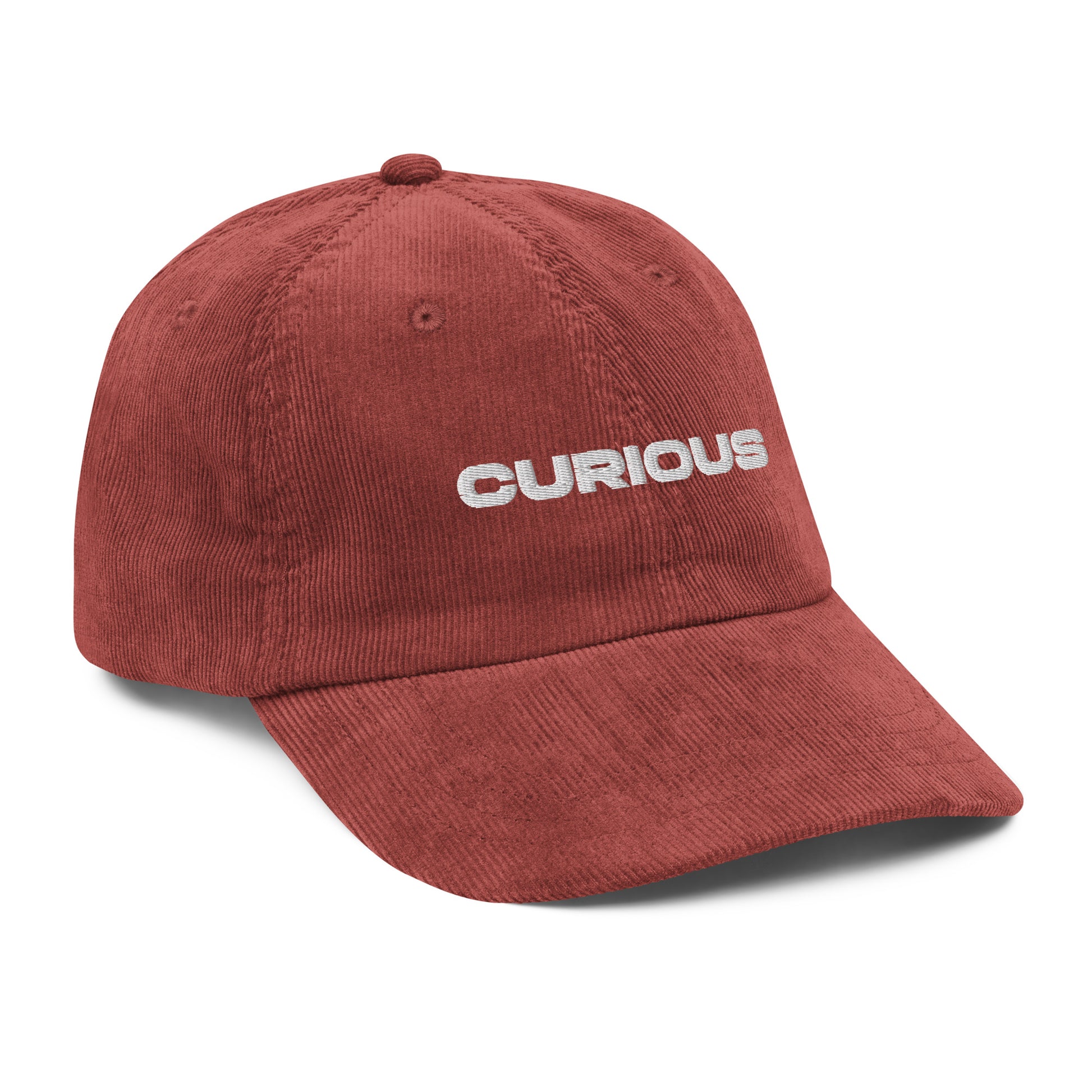 CURIOUS, text, type, hat, dad hat, corduroy, cozy, design. front left side view of rust hat on white background