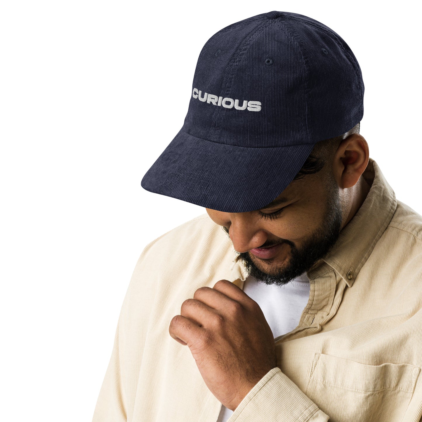CURIOUS, text, type, hat, dad hat, corduroy, cozy, design. front right side view of blue hat on male model