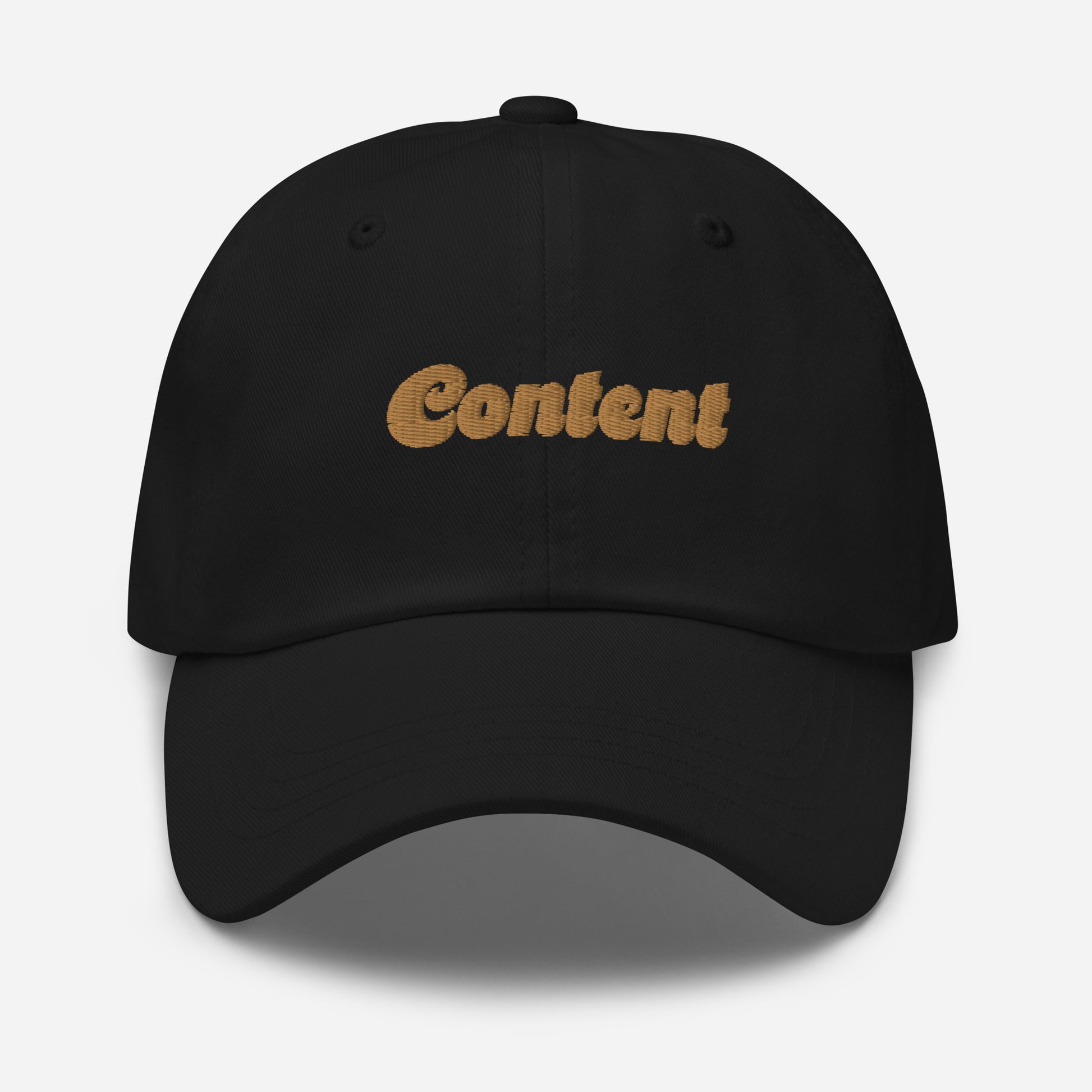 Portland city editions with “Content” type in gold embroidery on black casual dad hat front view on white background