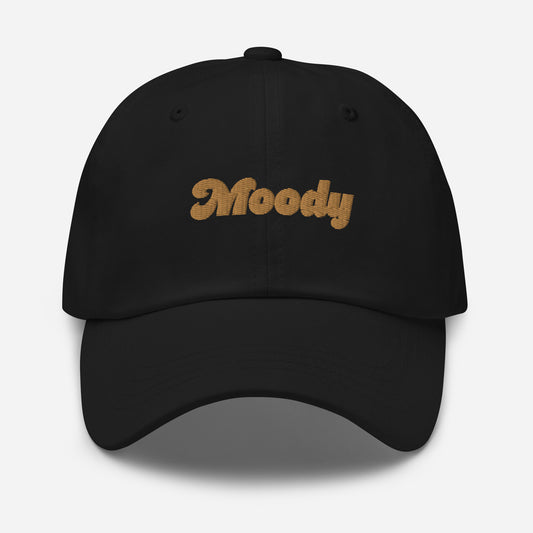 Portland city editions with “Moody” type in gold embroidery on black casual dad hat front view on white background