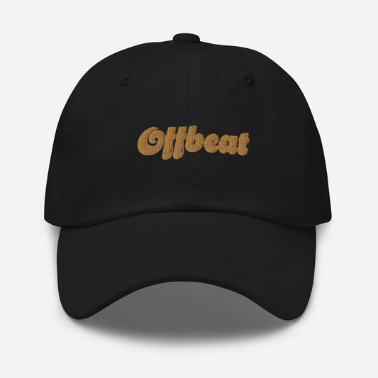 Portland city editions with “Offbeat” type in gold embroidery on black casual dad hat front view on white background