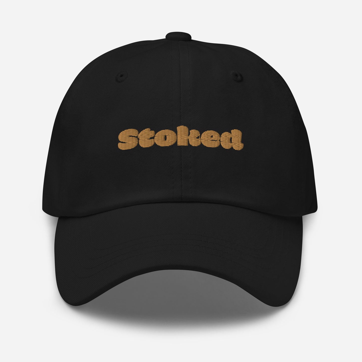 Los Angeles city editions with “Stoked” type in gold embroidery on black casual dad hat front view on white background