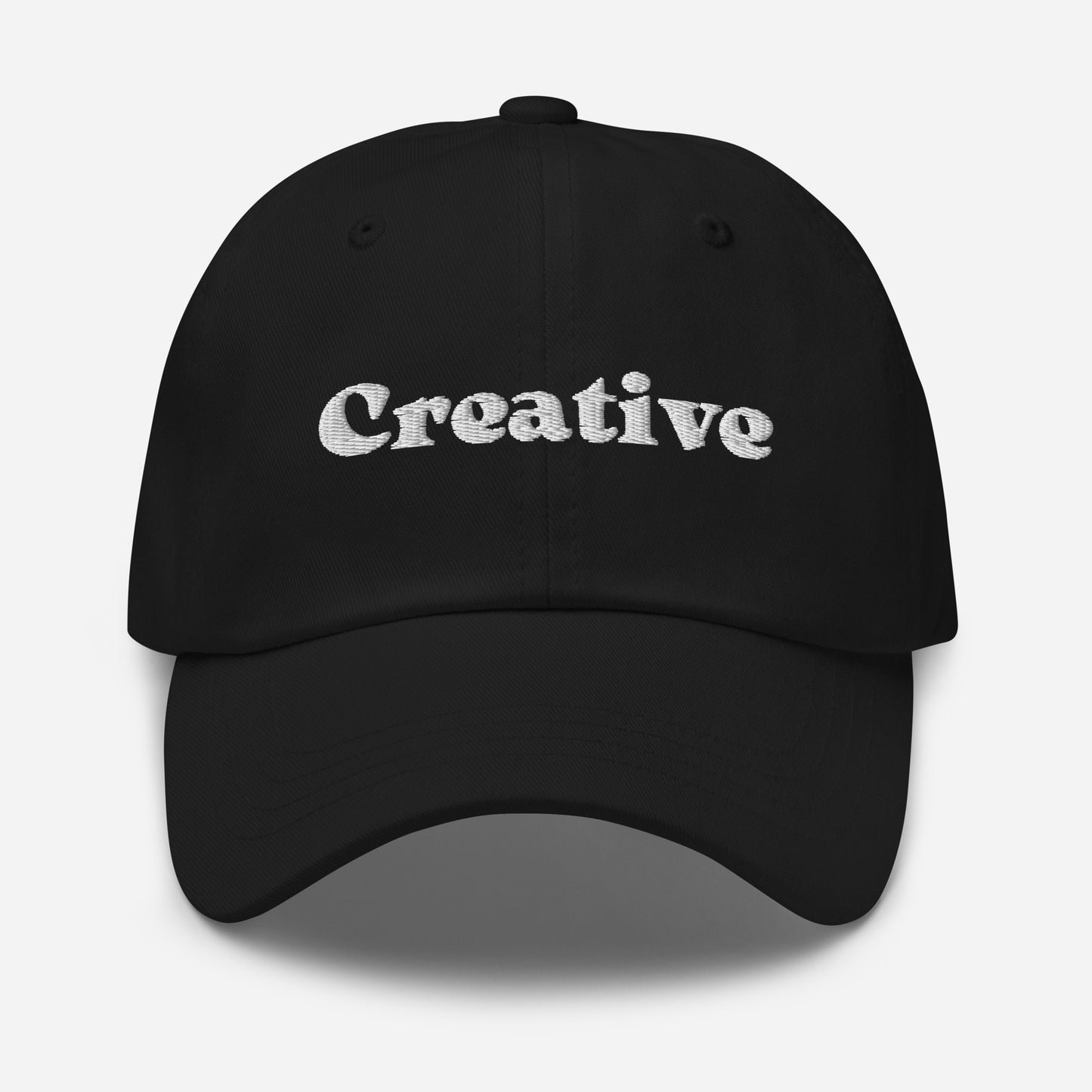 New York city editions with “Creative” type in white embroidery on black casual dad hat front view on white background