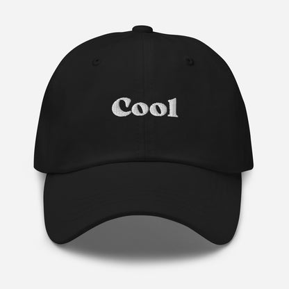 New York city editions with “Cool” type in white embroidery on black casual dad hat front view on white background