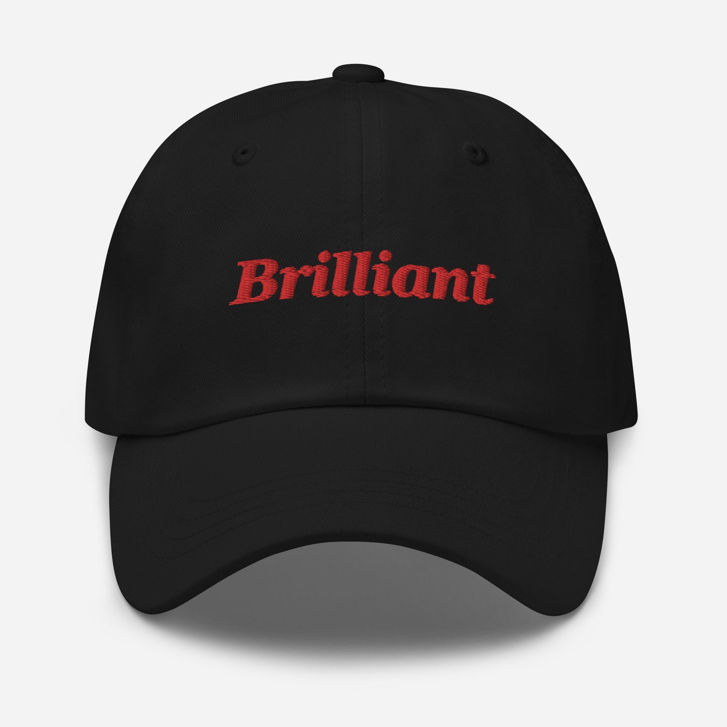 London city editions with “Brilliant” type in red embroidery on black casual dad hat front view on white background