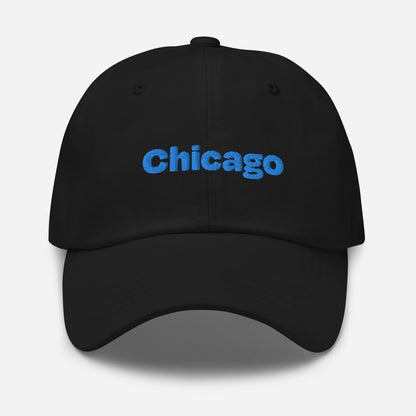 Chicago city editions with “Chicago” type in blue embroidery on black casual dad hat front view on white background