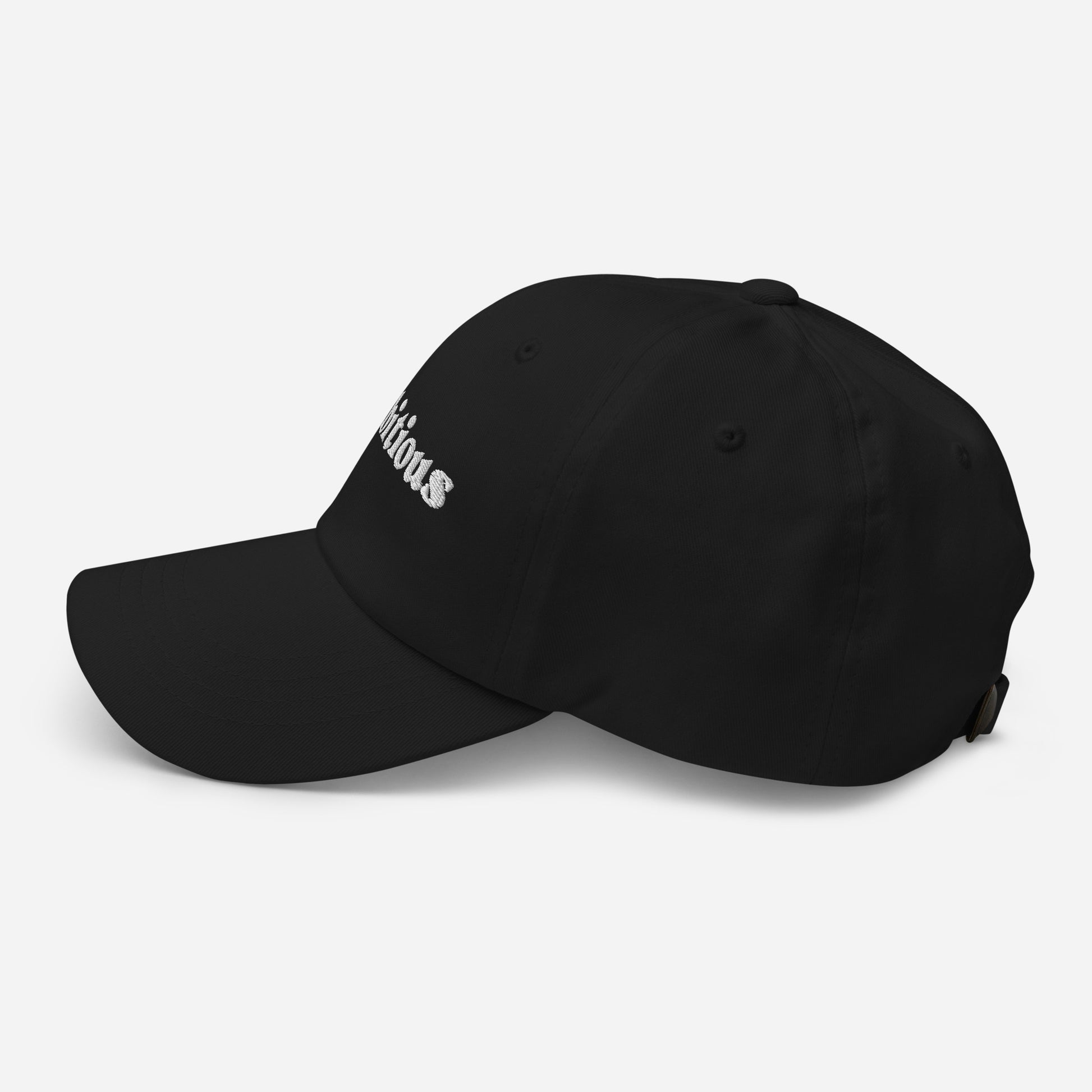 New York city editions with “Ambitious” type in white embroidery on black casual dad hat side view on white background