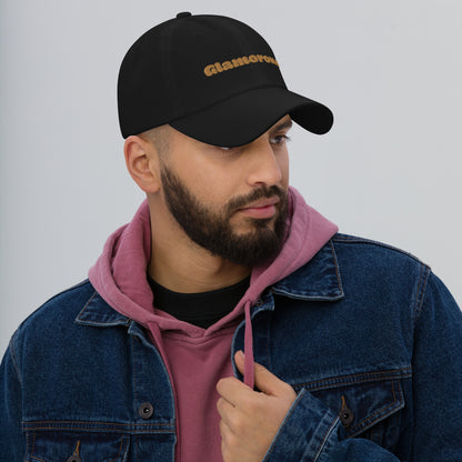 Los Angeles city editions with “Glamorous” type in gold embroidery on black casual dad hat front view on male model