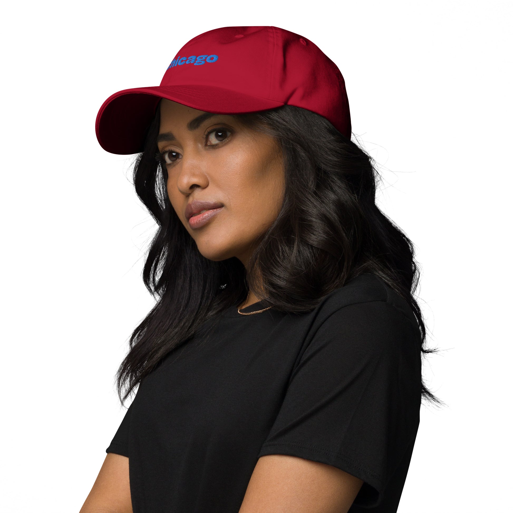 Chicago city editions with “Chicago” type in blue embroidery on red casual dad hat front view on female model