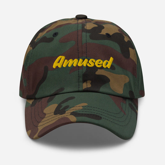 Austin city editions with “Amused” type in yellow embroidery on camo casual dad hat front view on white background