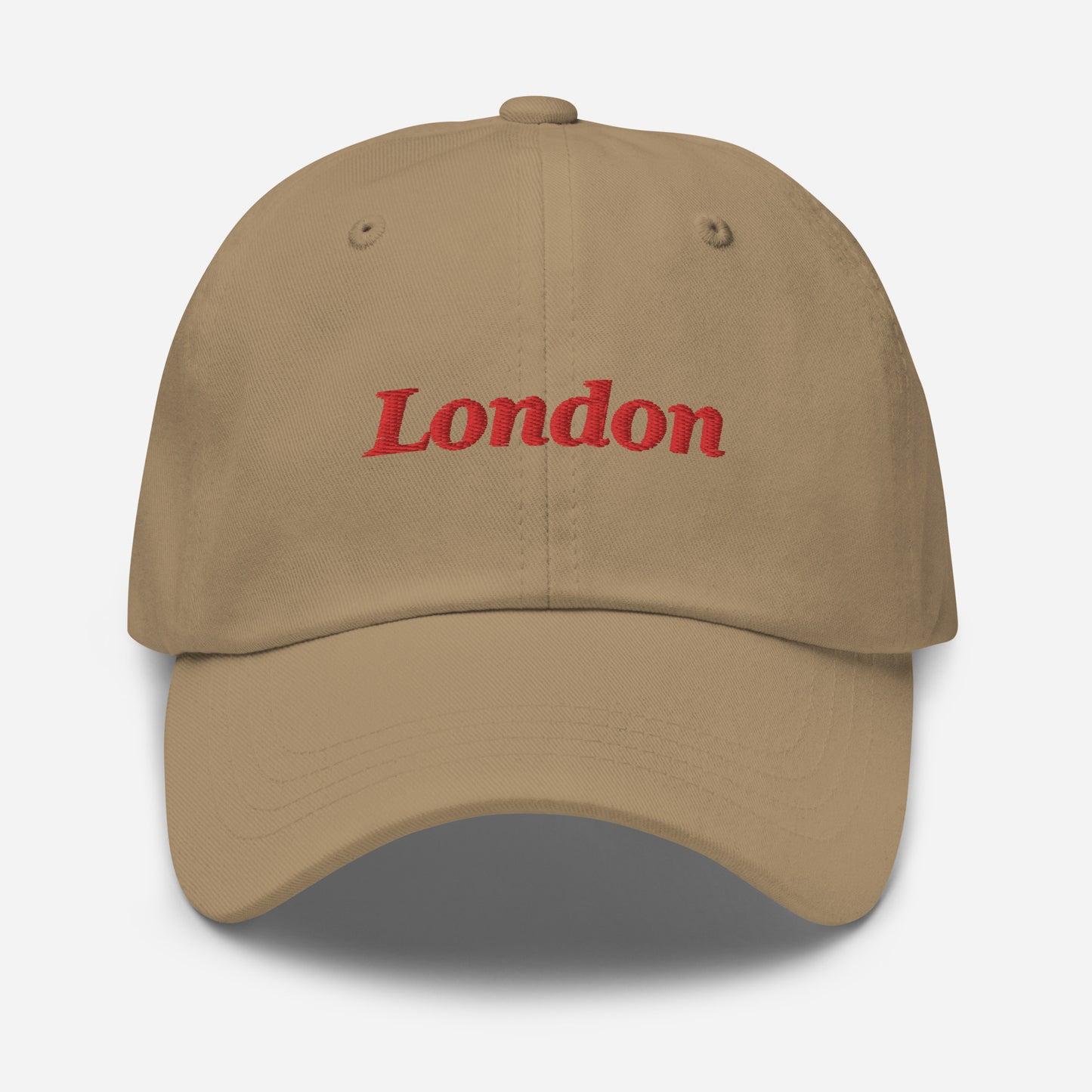 London city editions with “London” type in red embroidery on khaki casual dad hat front view on white background