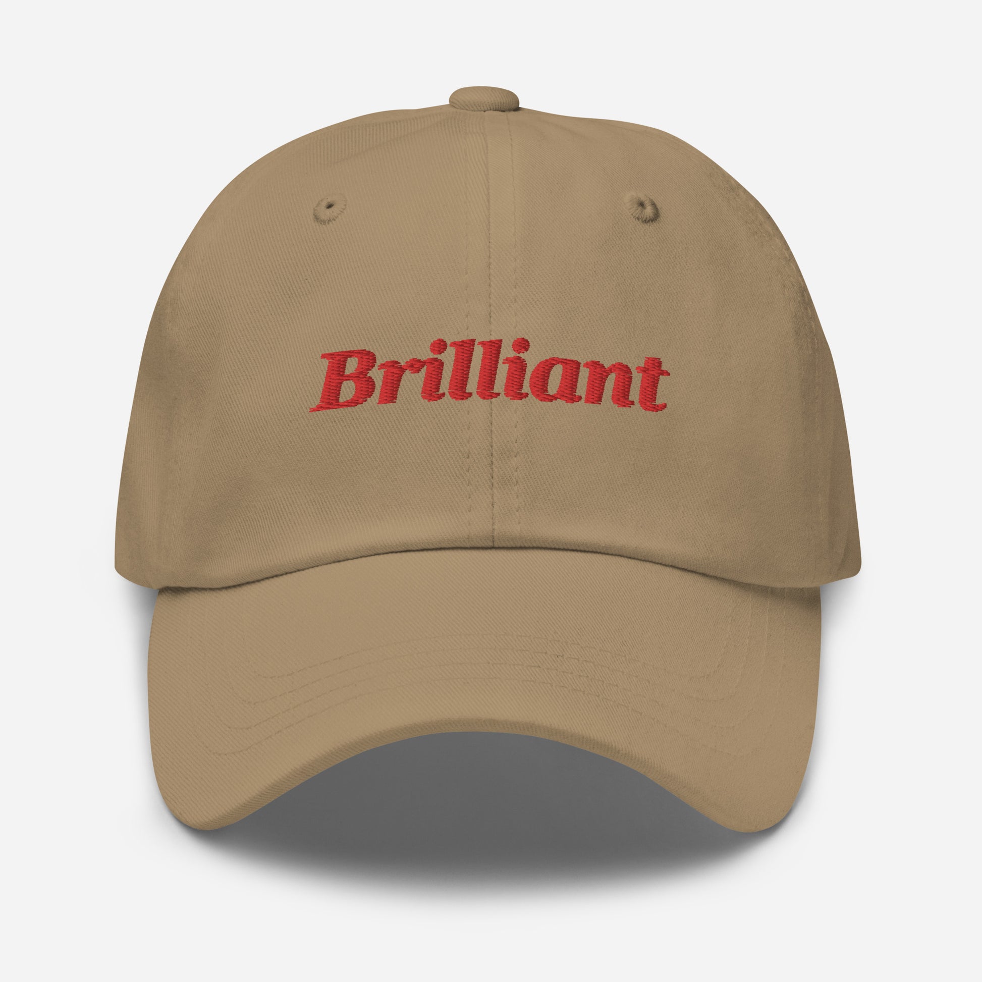 London city editions with “Brilliant” type in red embroidery on khaki casual dad hat front view on white background