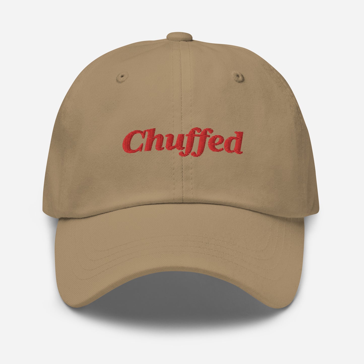 London city editions with “Chuffed” type in red embroidery on khaki casual dad hat front view on white background