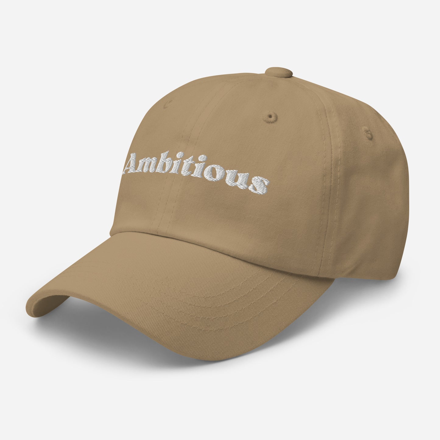 New York city editions with “Ambitious” type in white embroidery on khaki casual dad hat front side view on white background