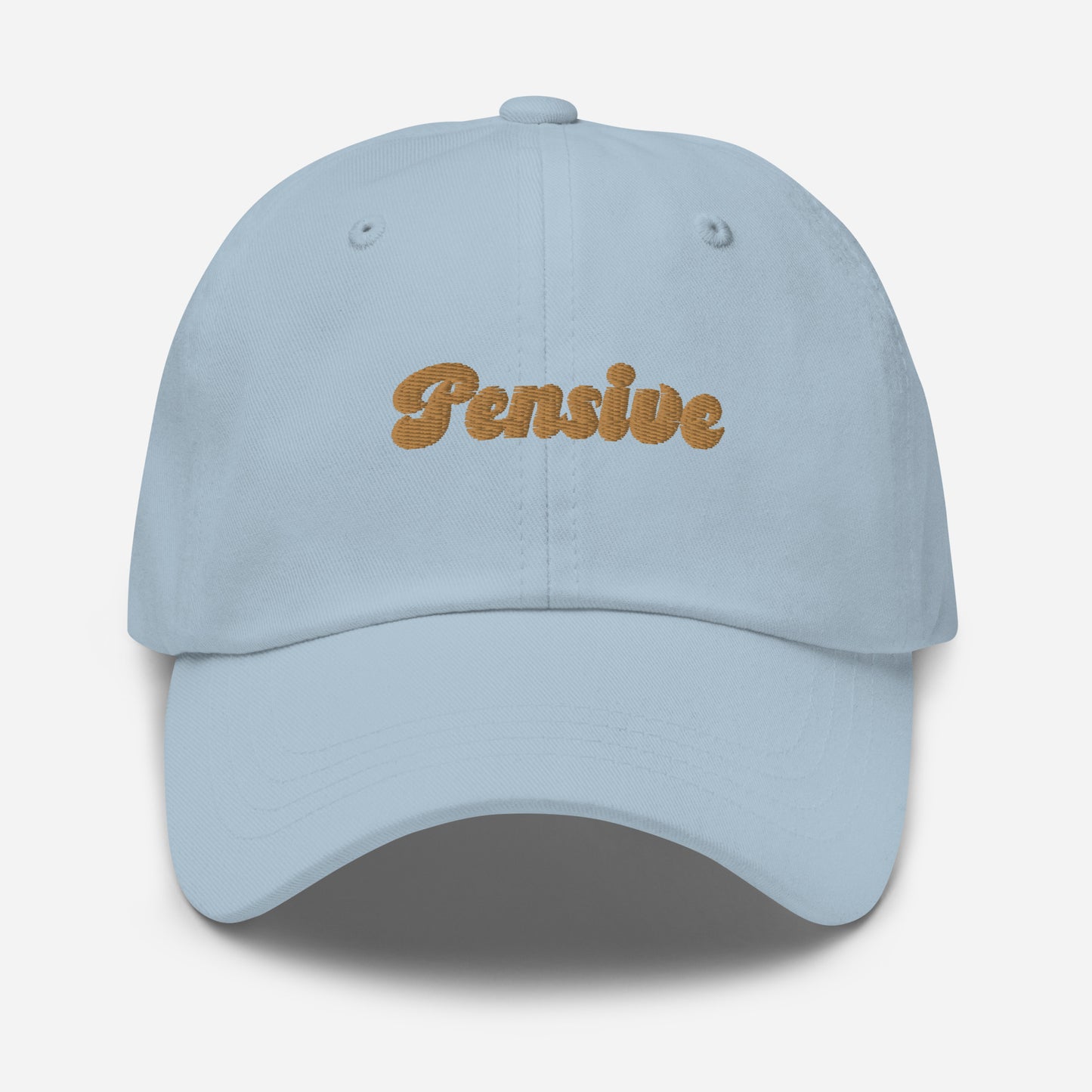 Portland city editions with “Pensive” type in gold embroidery on light blue casual dad hat front view on white background