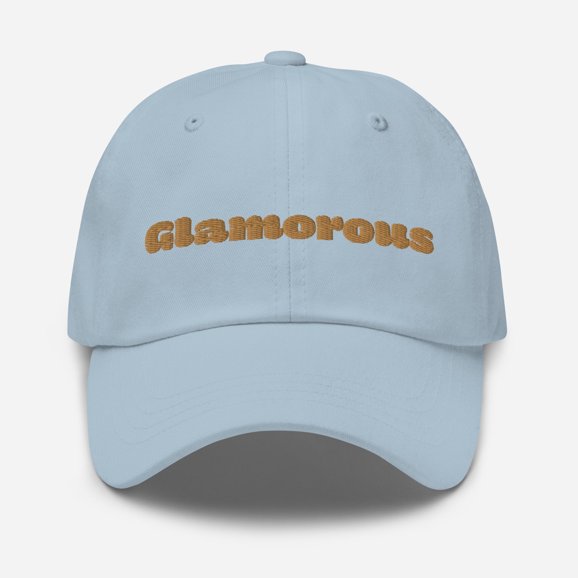 Los Angeles city editions with “Glamorous” type in gold embroidery on light blue casual dad hat front view on white background